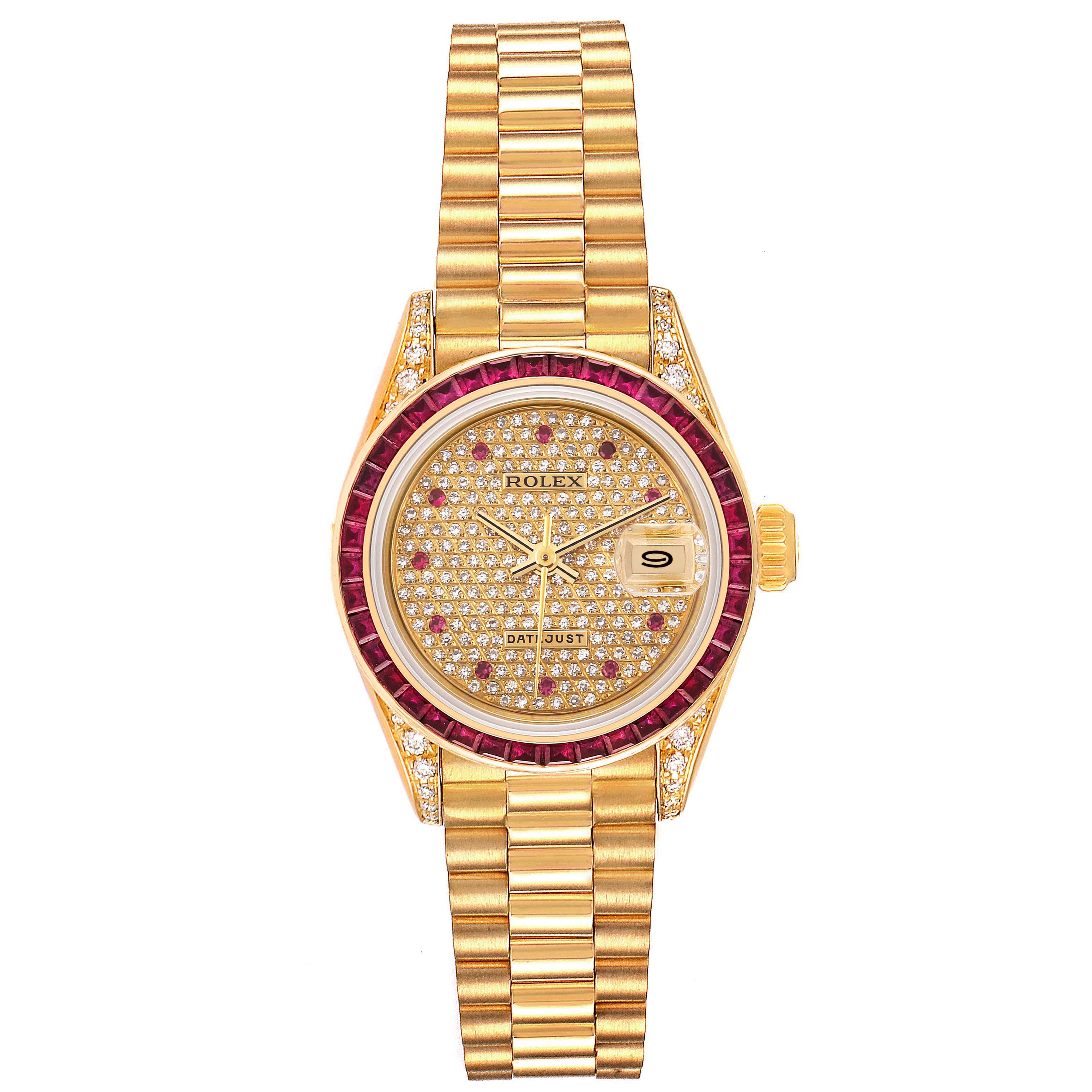 The image shows a Rolex President 69028 Women's Yellow Gold  69028 Women's Yellow Gold  model watch with a gold bracelet, diamond-studded dial, and ruby bezel from a top-down angle.