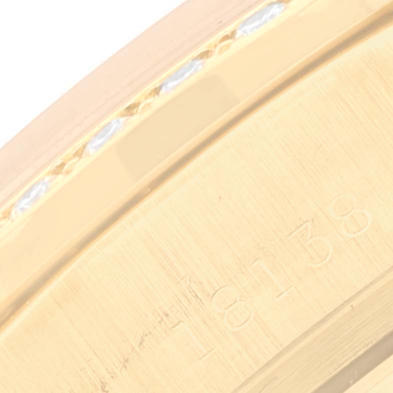 This close-up image shows the side of the Rolex President 18138 Men's Yellow Gold Champagne Dial 18138 Men's Yellow Gold Champagne Dial model watch, highlighting its bracelet link engraved with the number 18138.
