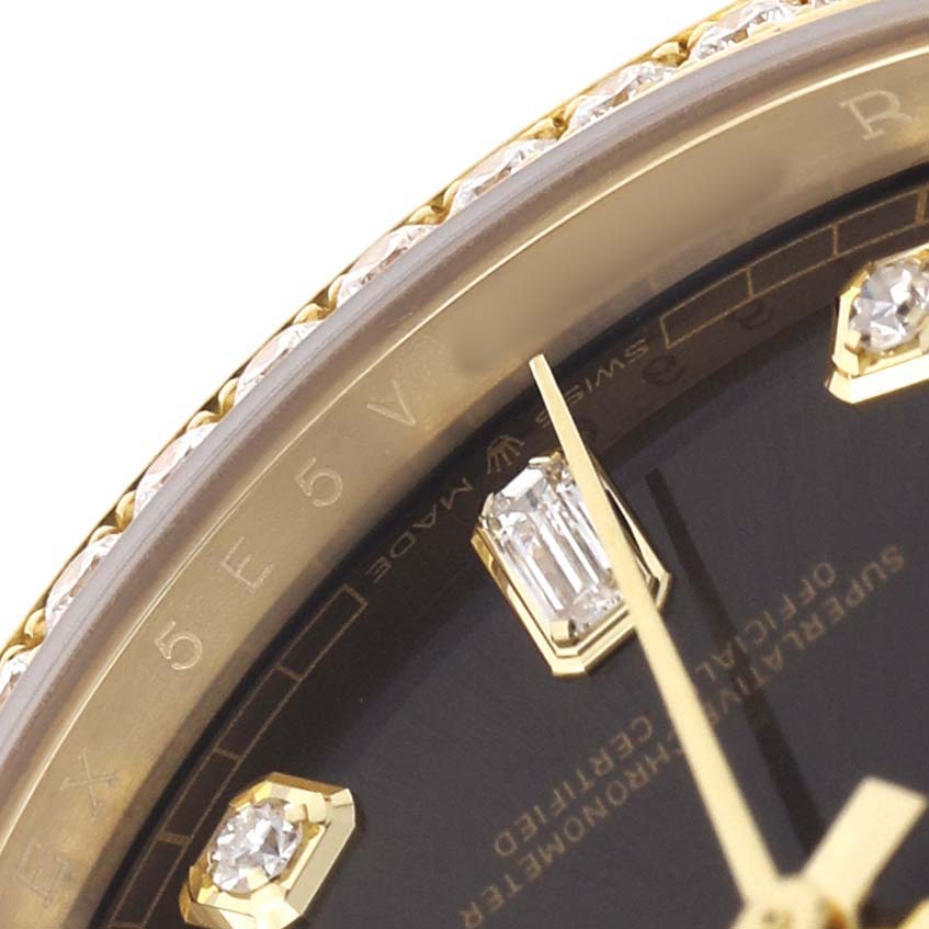 The image shows a close-up of the dial, bezel, and diamond markers of a Rolex President 128348 Men's Yellow Gold Brown Dial model watch.