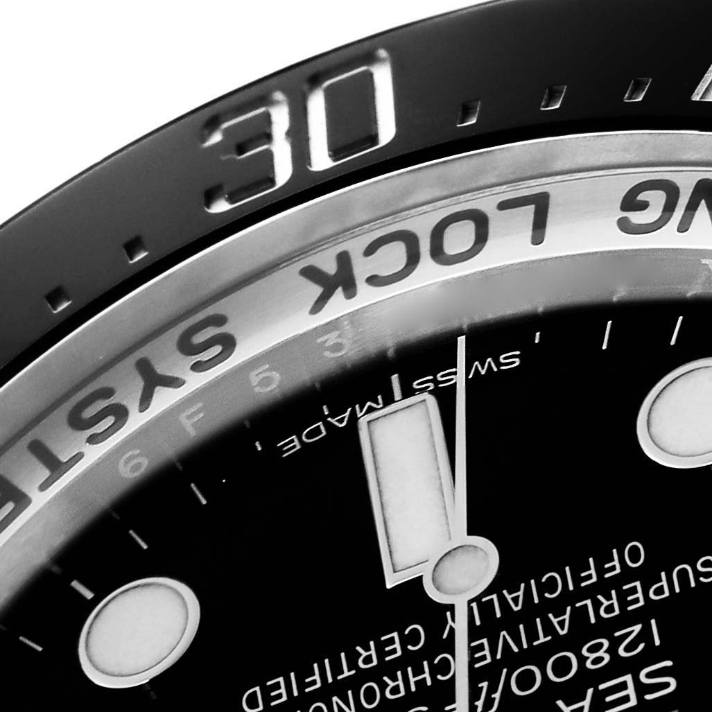 The image shows a close-up angled view of the bezel and dial of the Rolex Sea-Dweller model 116660, highlighting part of the markings and hour indicators.