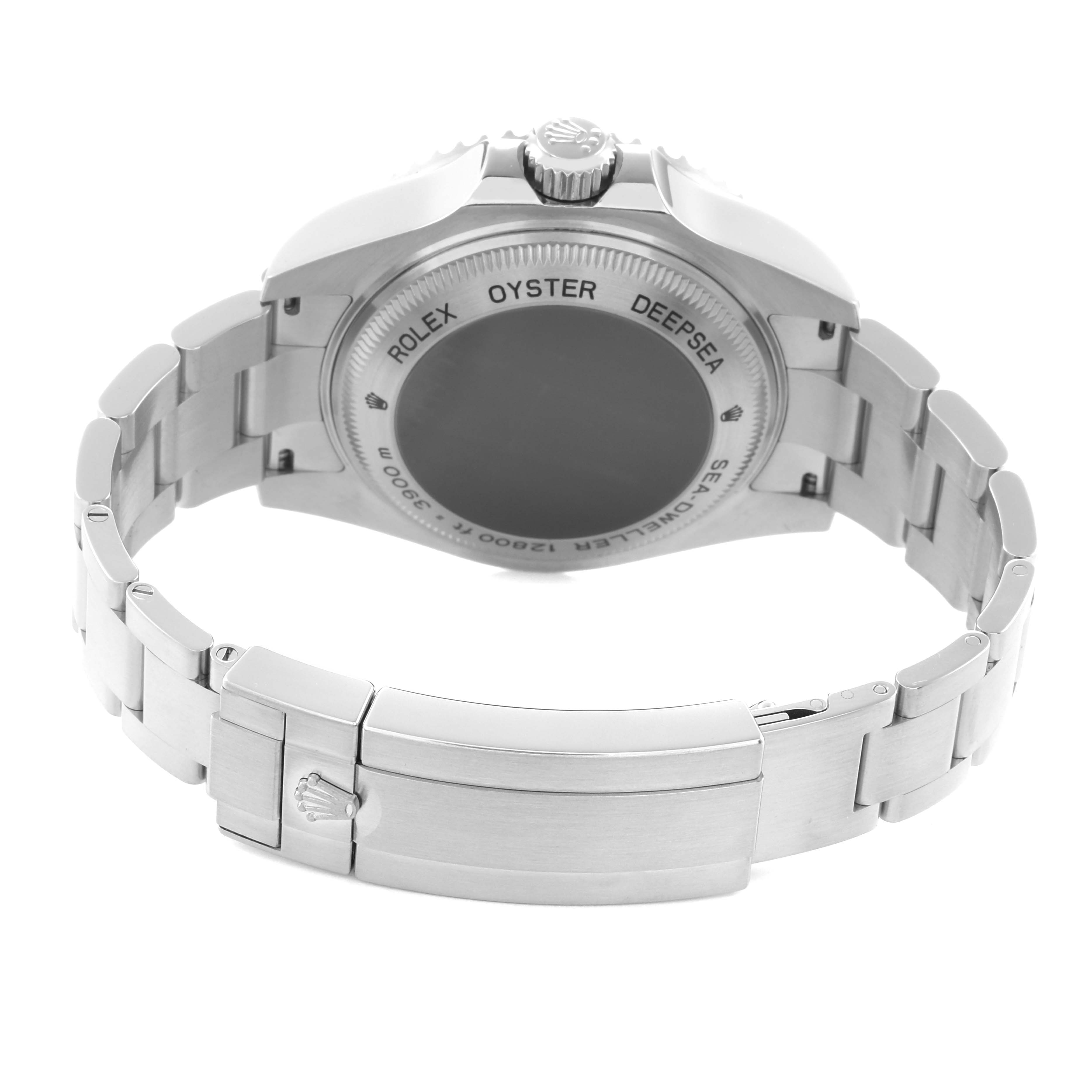 The image shows the back of a Rolex Sea-Dweller model 116660, focusing on the clasp, bracelet, and case back of the watch.