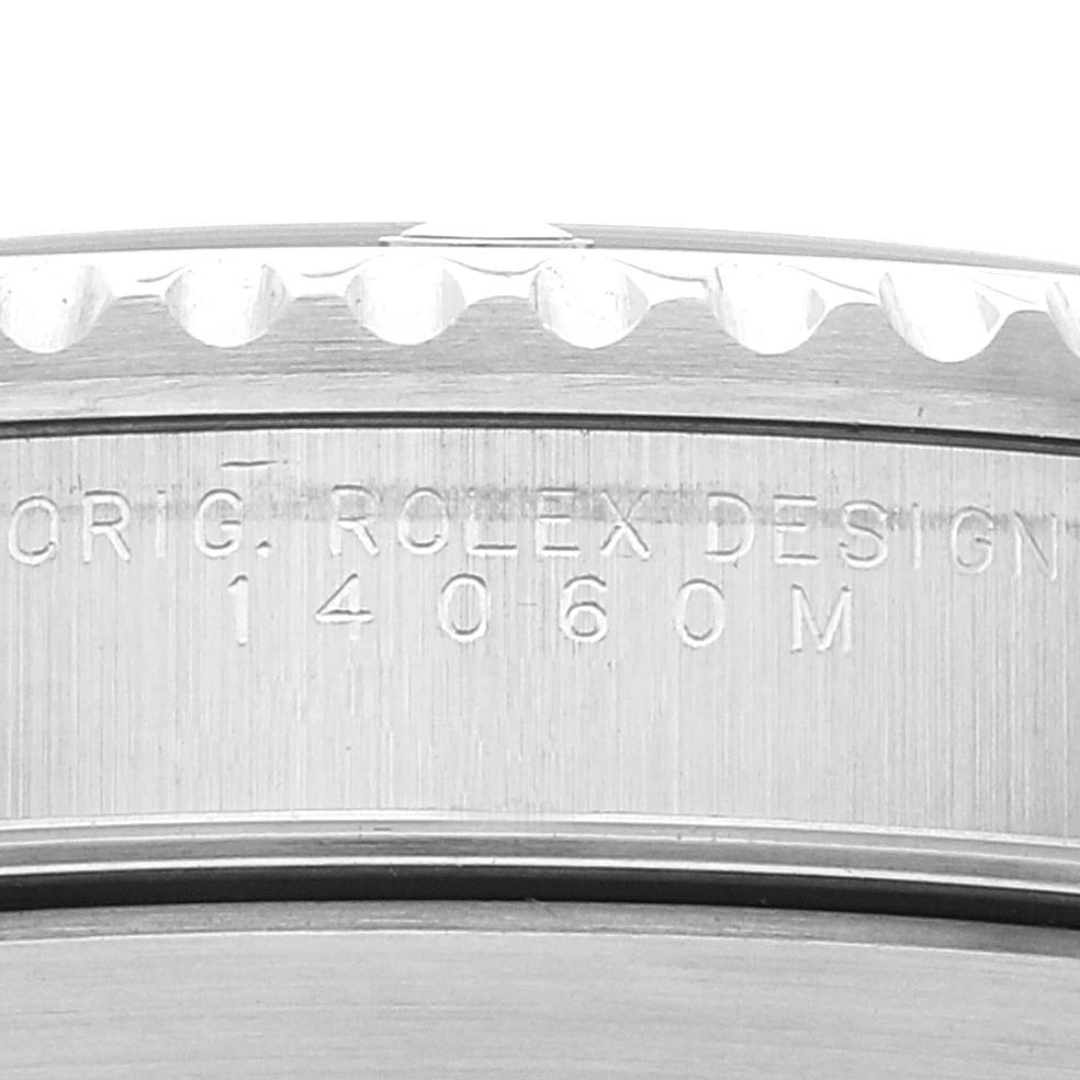 This close-up image shows the engraved model number on the case of a Rolex Submariner 14060 Men's Stainless Steel Black Dial 14060 Men's Stainless Steel Black Dial watch.