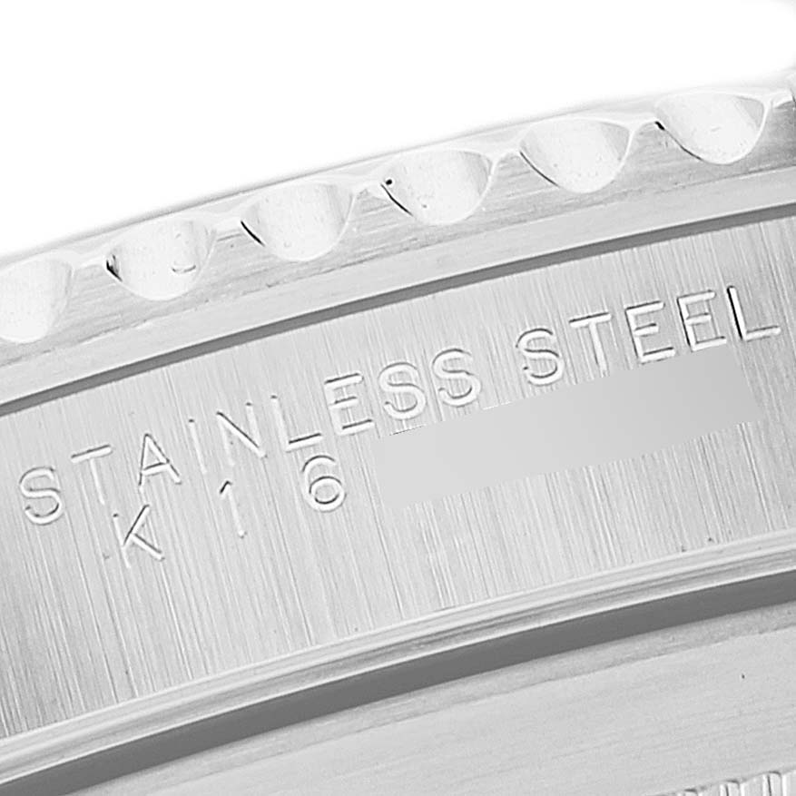 The image displays a close-up of the engraved stainless steel part on a Rolex Submariner 14060 Men's Stainless Steel Black Dial 14060 Men's Stainless Steel Black Dial model.