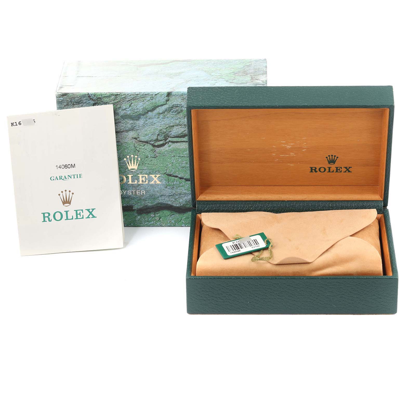 This image shows the packaging of a Rolex Submariner 14060 Men's Stainless Steel Black Dial 14060 Men's Stainless Steel Black Dial, including its open box, outer box, and warranty booklet.
