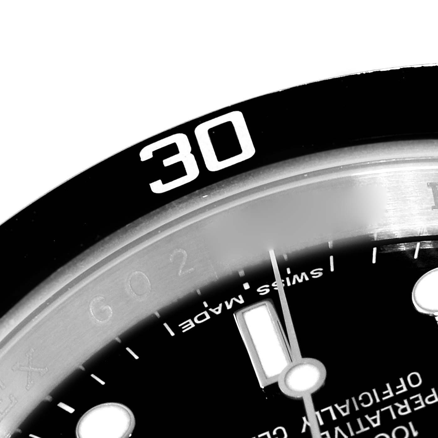 The image shows a close-up of the bezel and part of the dial of a Rolex Submariner 16610 Men
s Stainless Steel Black Dial 16610 Men
s Stainless Steel Black Dial watch.