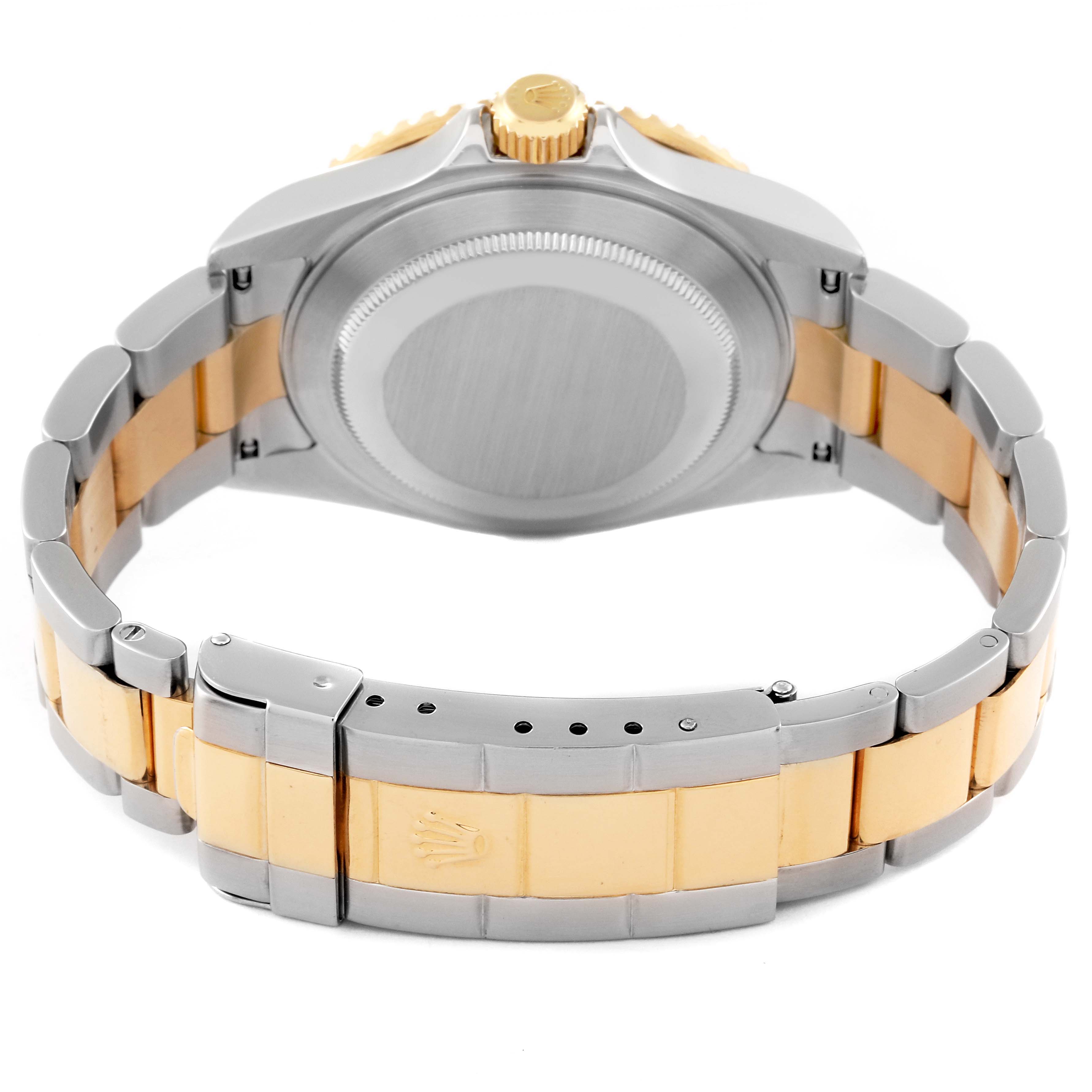 The image shows the back view of a Rolex Submariner 16613 Men's Steel and Gold (two tone) Blue Dial 16613 Men's Steel and Gold (two tone) Blue Dial watch, highlighting the case back, crown, and two-tone bracelet with a clasp.