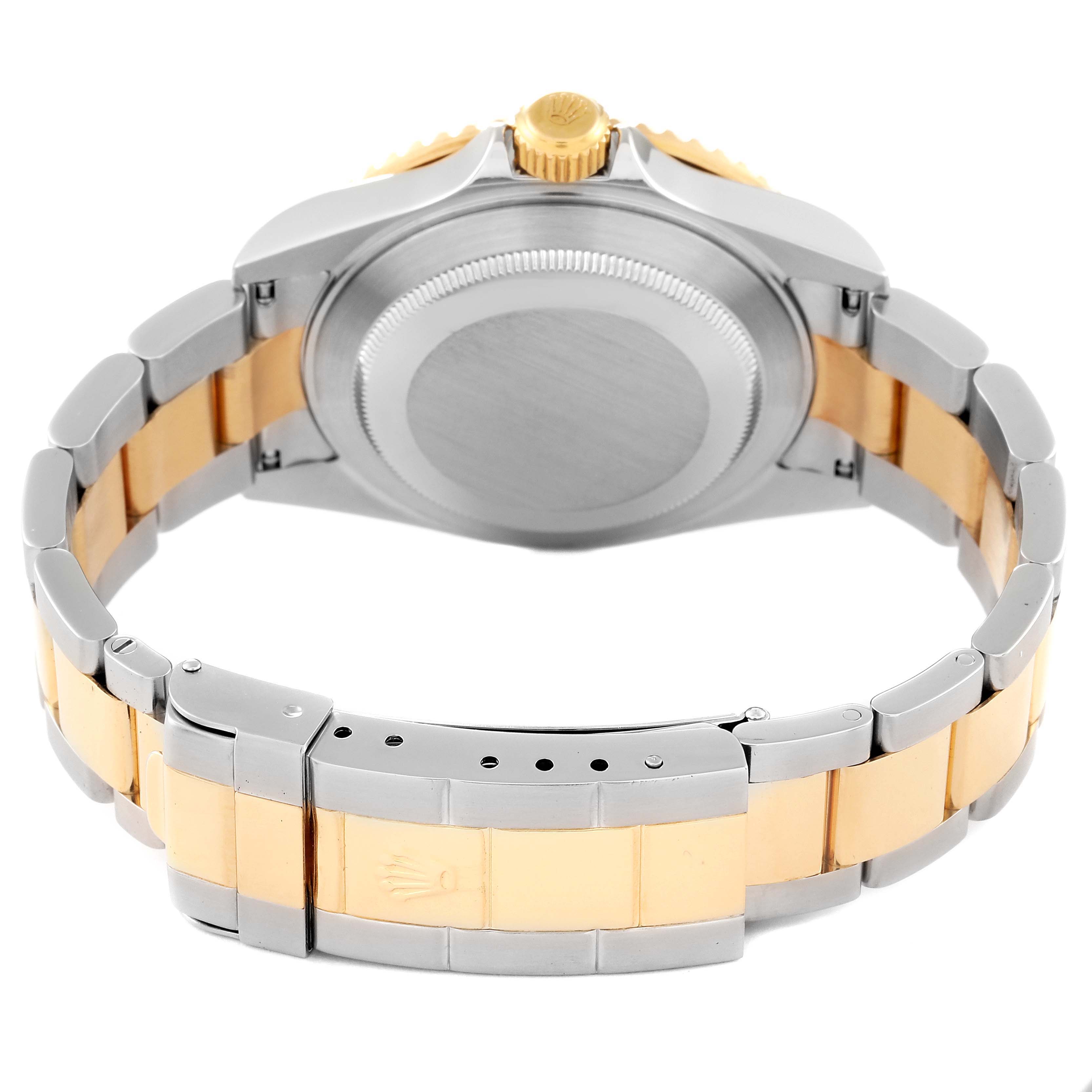 The image shows the backside and bracelet of a Rolex Submariner 16613 Men's Steel and Gold (two tone) Blue Dial 16613 Men's Steel and Gold (two tone) Blue Dial watch, highlighting its two-tone metal design and clasp detail.