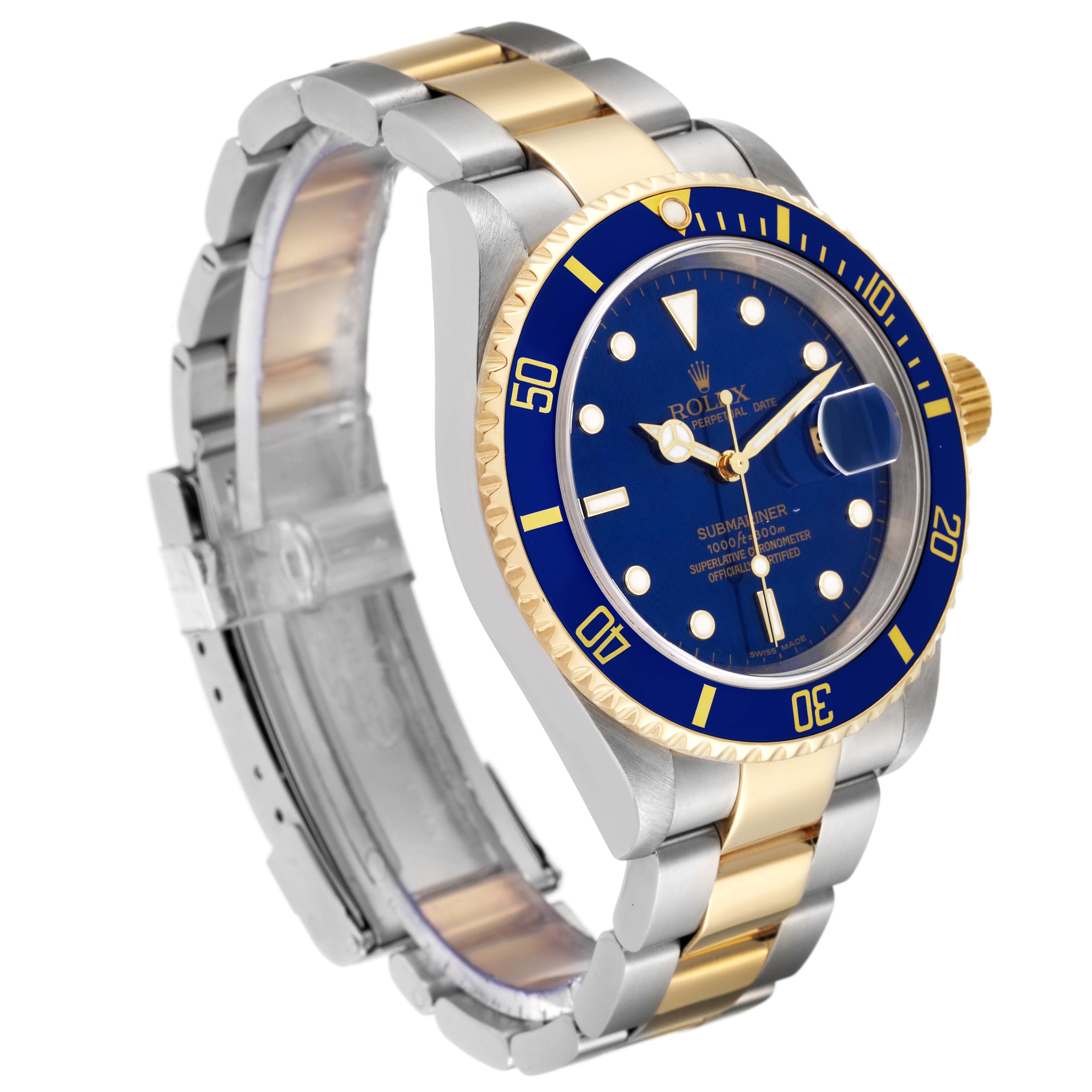 The image shows a Rolex Submariner 16613 Men's Steel and Gold (two tone) Blue Dial 16613 Men's Steel and Gold (two tone) Blue Dial watch at a three-quarter angle, highlighting the blue dial, bezel, and two-tone bracelet.