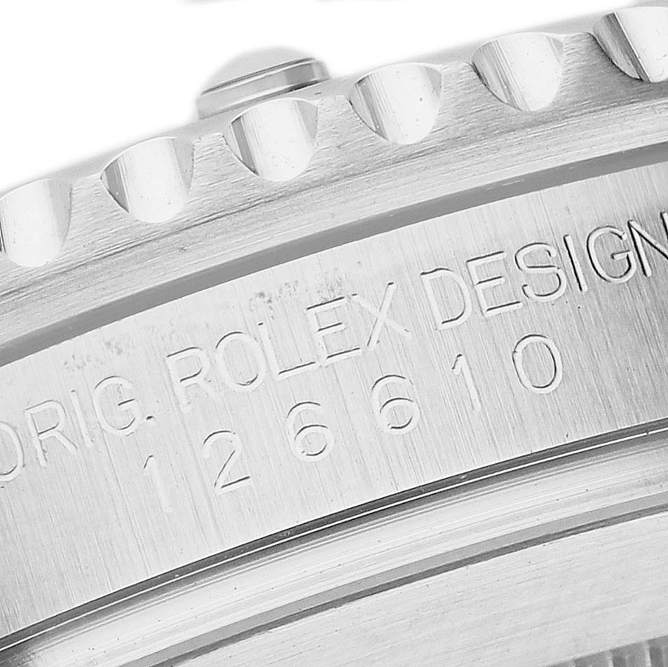 The image shows a close-up of the engraved side of the Rolex Submariner 126610LN Men's Stainless Steel Black Dial, featuring design and model number details.