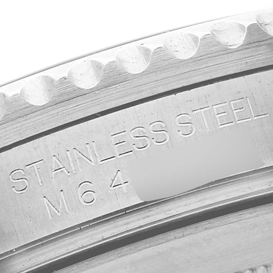 This close-up image shows the engravings on the stainless steel case back of a Rolex Submariner 16610LV Men's Stainless Steel Black Dial 16610LV Men's Stainless Steel Black Dial watch.