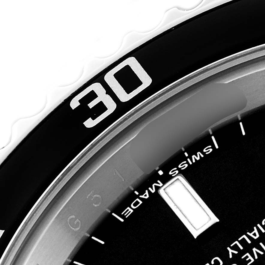 The image shows a close-up of the bezel and dial of a Rolex Submariner 14060M Men
s Stainless Steel Black Dial 14060M Men
s Stainless Steel Black Dial, highlighting the "30" mark and part of the "Swiss Made" text.