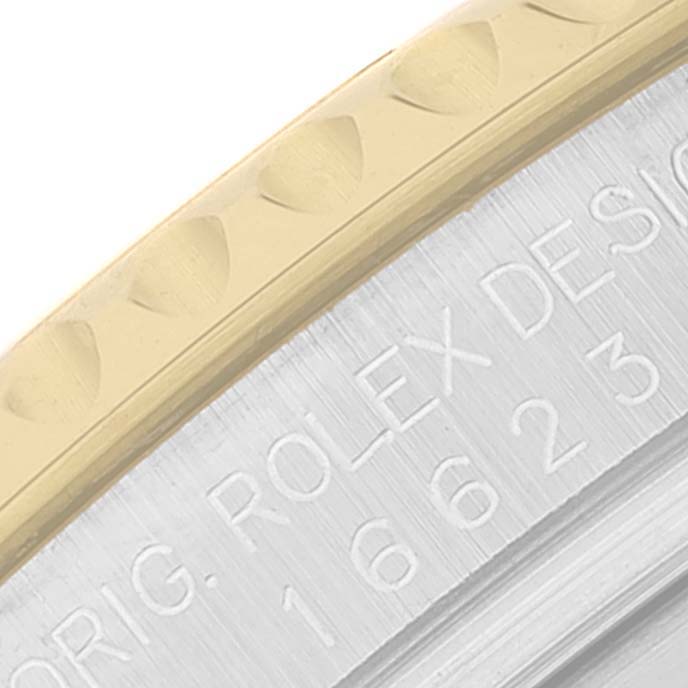This image shows a close-up of the bezel and case side of a Rolex Yacht-Master 16623 Men
s Steel and Gold (two tone) White Dial 16623 Men
s Steel and Gold (two tone) White Dial watch, highlighting its design and model engraving.