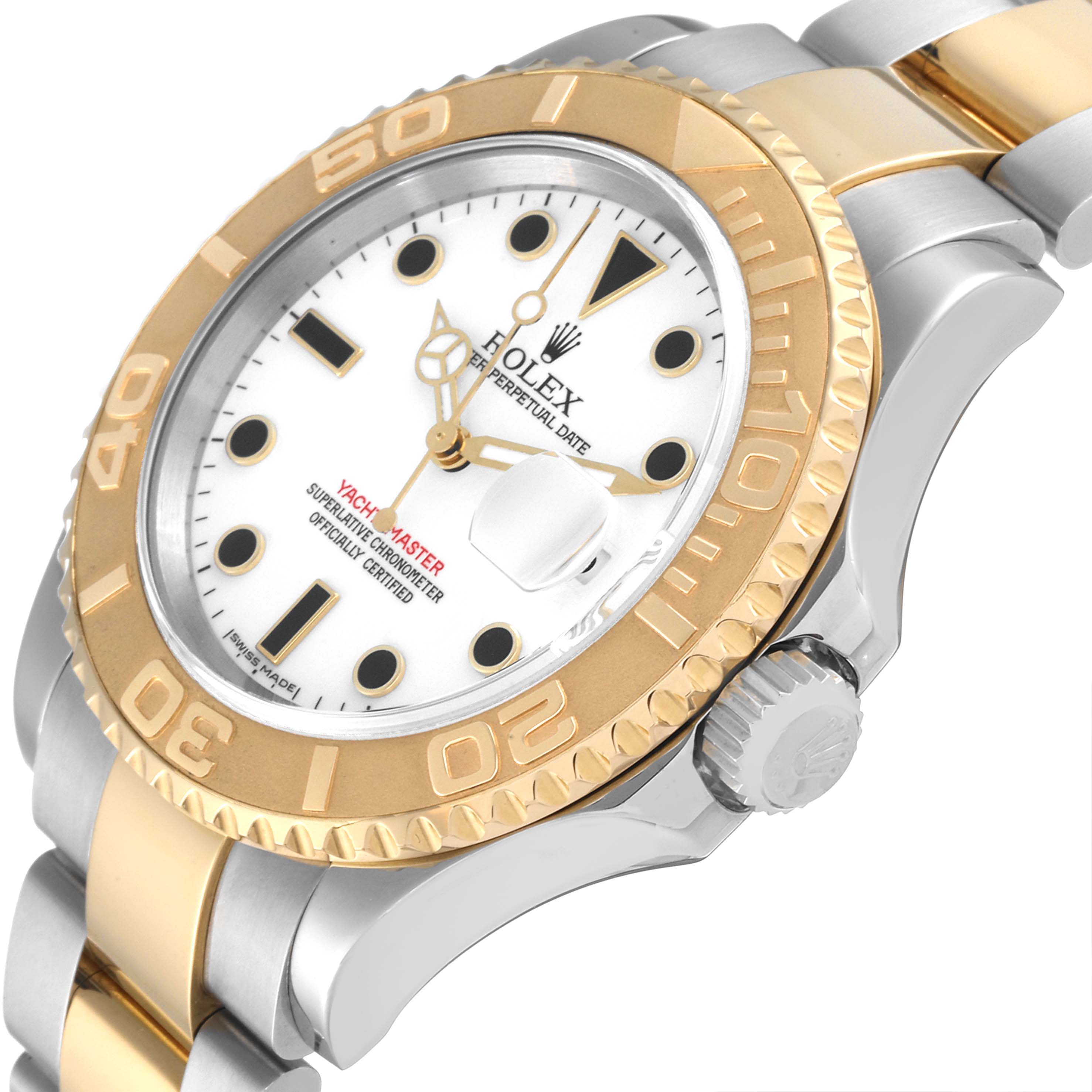 The image shows a close-up, angled side view of a Rolex Yacht-Master 16623 Men
s Steel and Gold (two tone) White Dial 16623 Men
s Steel and Gold (two tone) White Dial watch highlighting its bezel, crown, and dial.