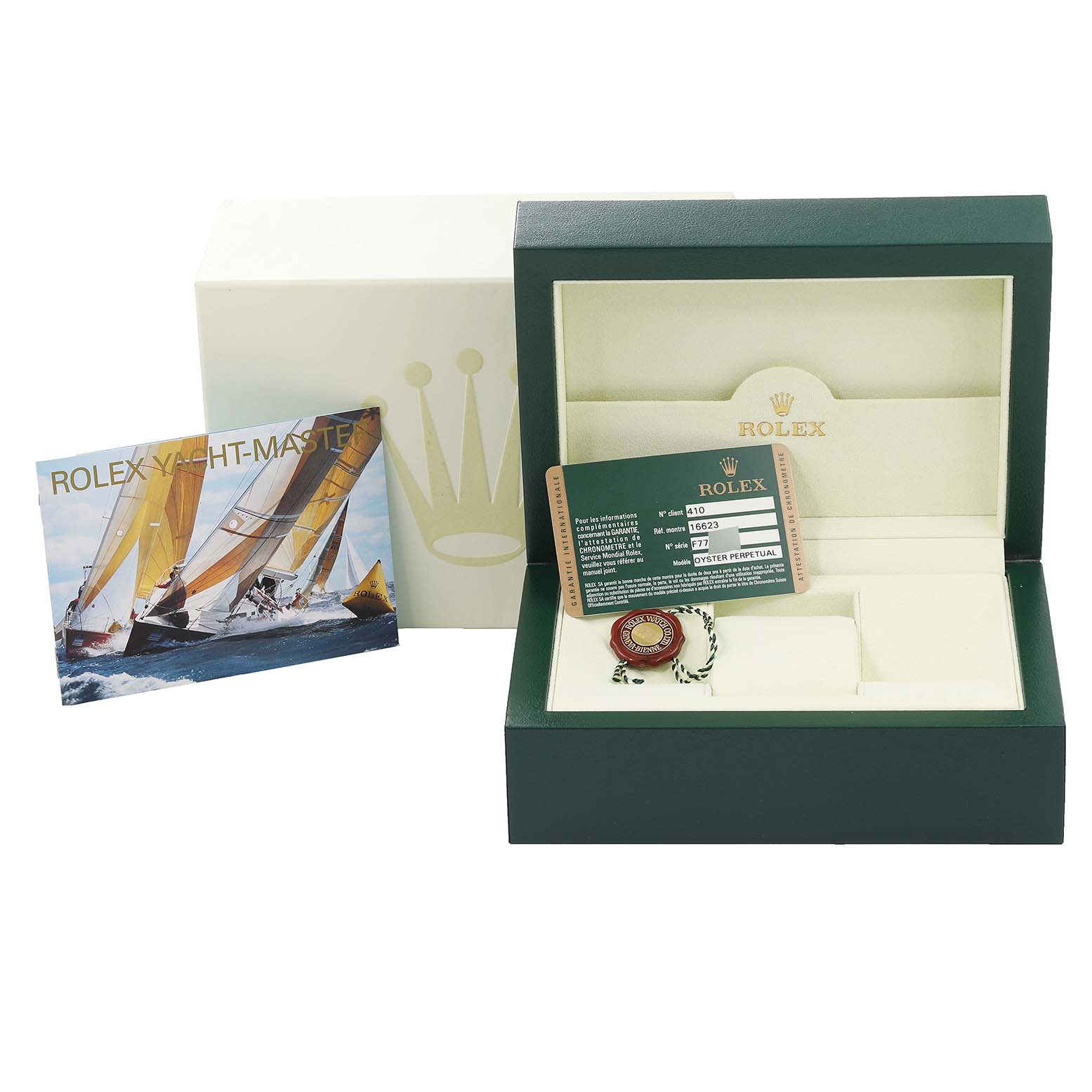 The image shows the Rolex Yacht-Master 16623 Men
s Steel and Gold (two tone) White Dial 16623 Men
s Steel and Gold (two tone) White Dial watch box, warranty card, and booklet from a front angle.