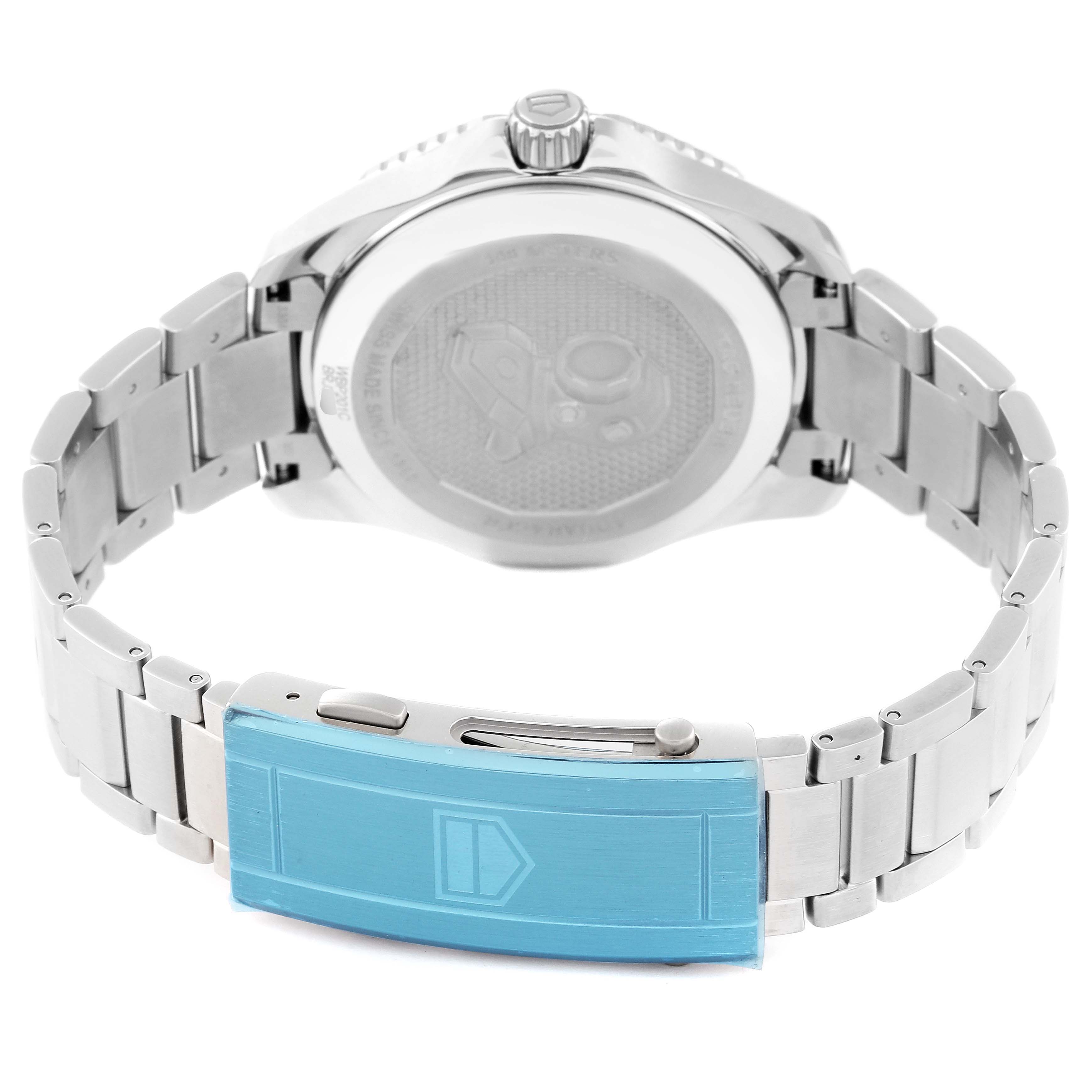 The image shows the back view of a Tag Heuer Aquaracer WBP201C Men's Stainless Steel Silver Dial WBP201C Men's Stainless Steel Silver Dial watch, focusing on its case back and metallic bracelet with a blue clasp.