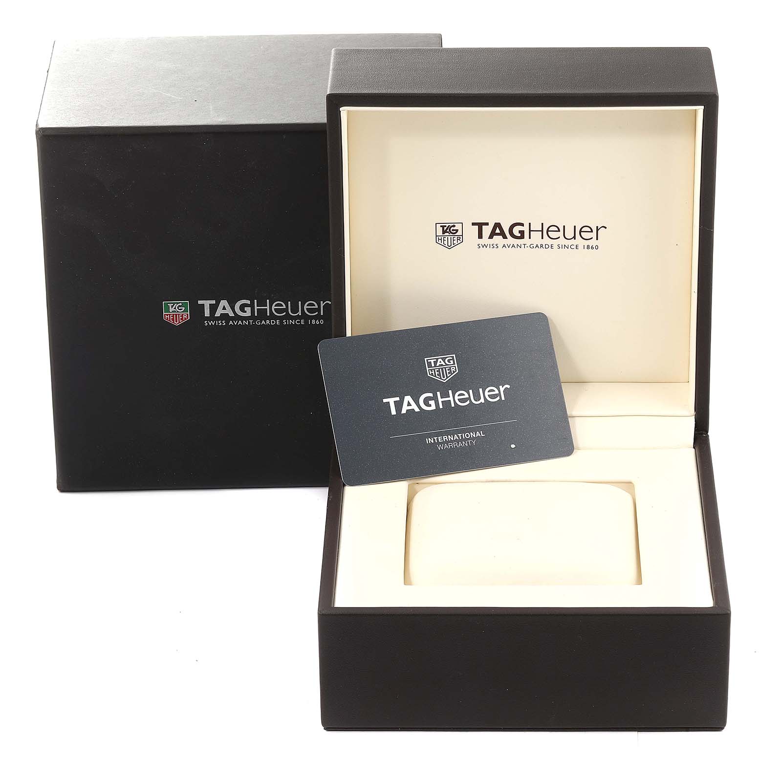 This image shows the Tag Heuer Carrera CAR2A1W.BA0703 Men's Stainless Steel Transparent Dial CAR2A1W.BA0703 Men's Stainless Steel Transparent Dial watch box and an international warranty card at an angled top view.