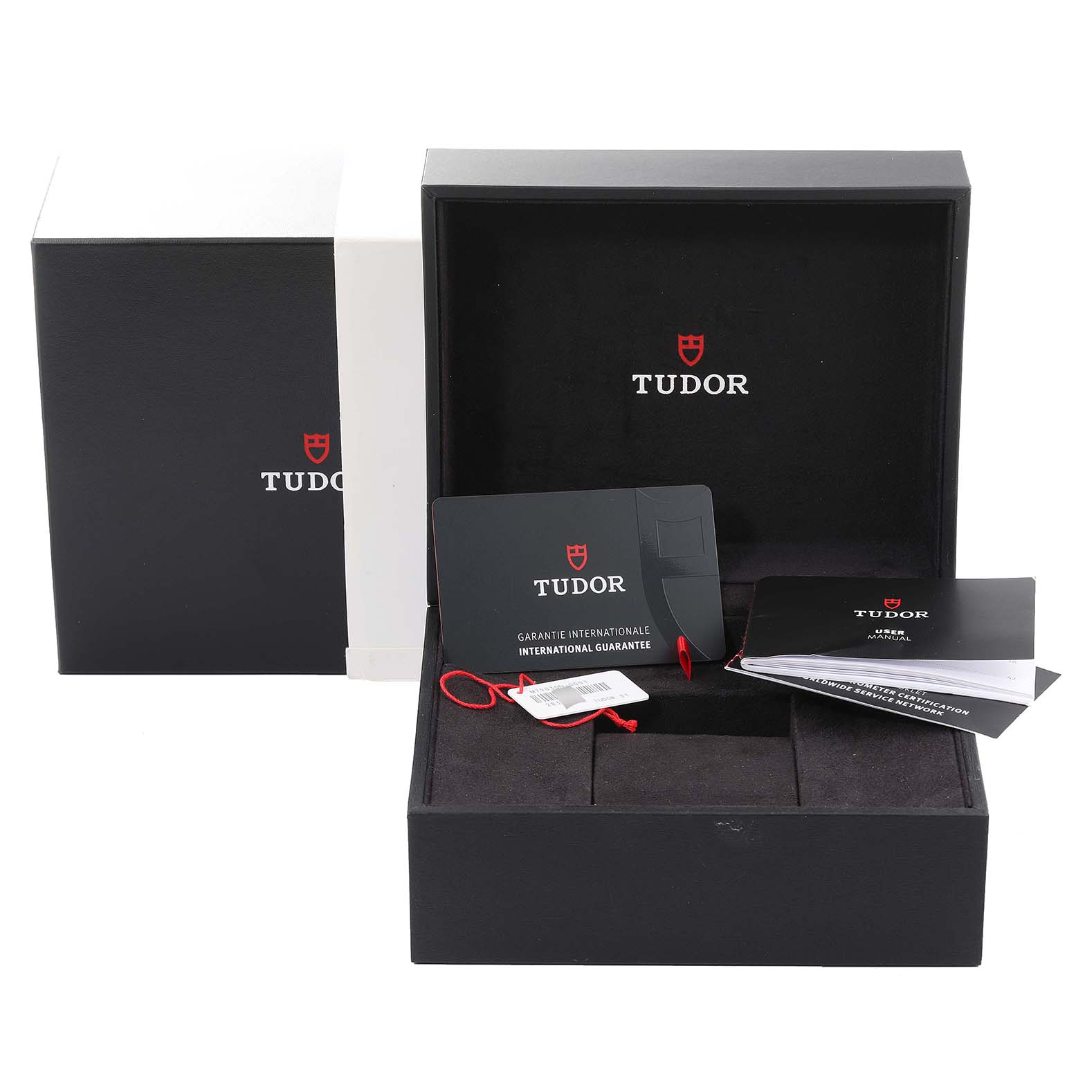 This image shows the Tudor Heritage Black Bay 79030N Men's Stainless Steel Black Dial 79030N Men's Stainless Steel Black Dial watch box, warranty card, hang tag, and user manual.