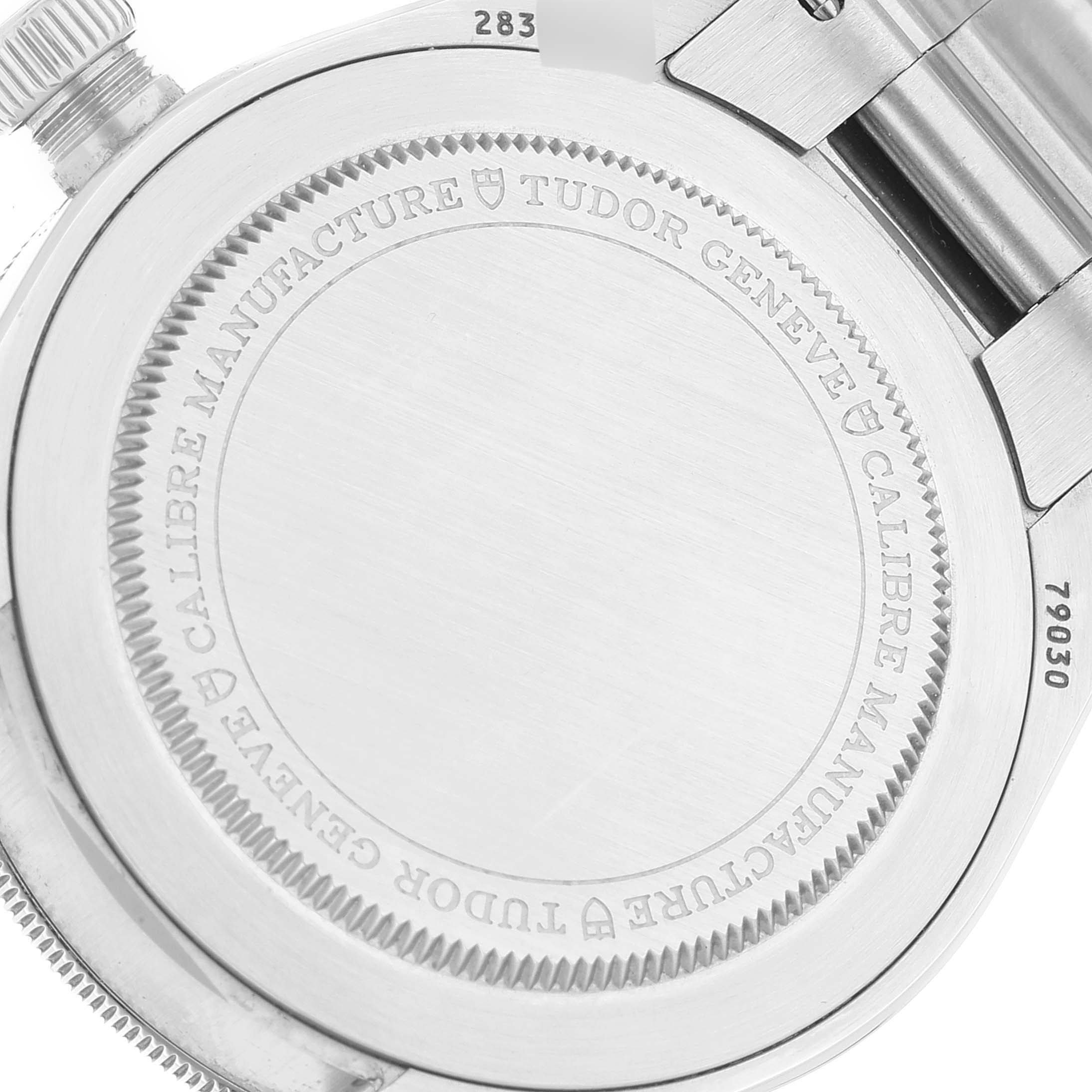 The image shows a close-up of the case back of a Tudor Heritage Black Bay 79030N Men's Stainless Steel Black Dial 79030N Men's Stainless Steel Black Dial watch, featuring engravings.