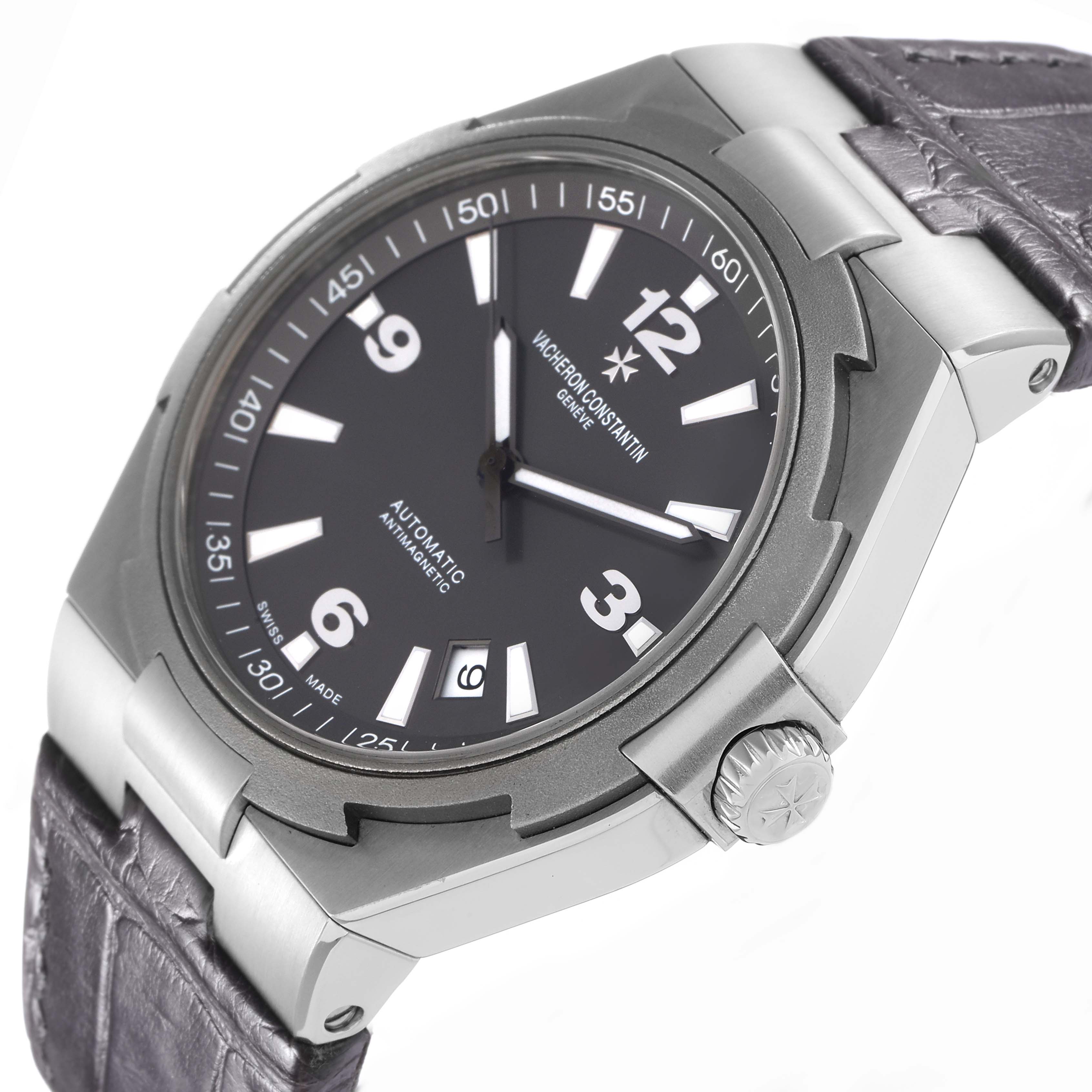 The Vacheron Constantin Overseas model 47040 is shown at an angled view highlighting the dial, bezel, crown, and part of the strap.