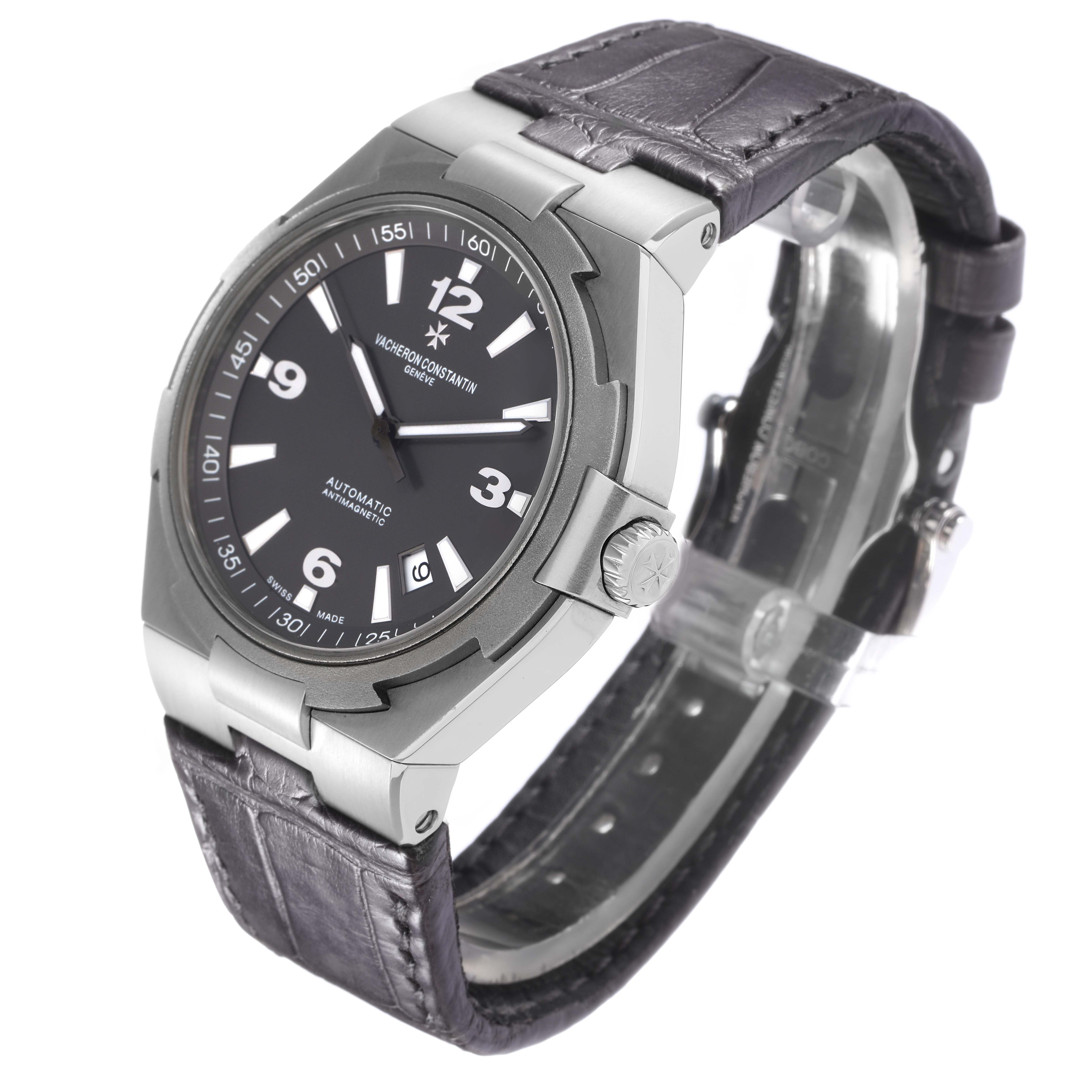 The Vacheron Constantin Overseas model 47040 men's watch is shown at an angled view, highlighting the dial, bezel, case, crown, and leather strap.