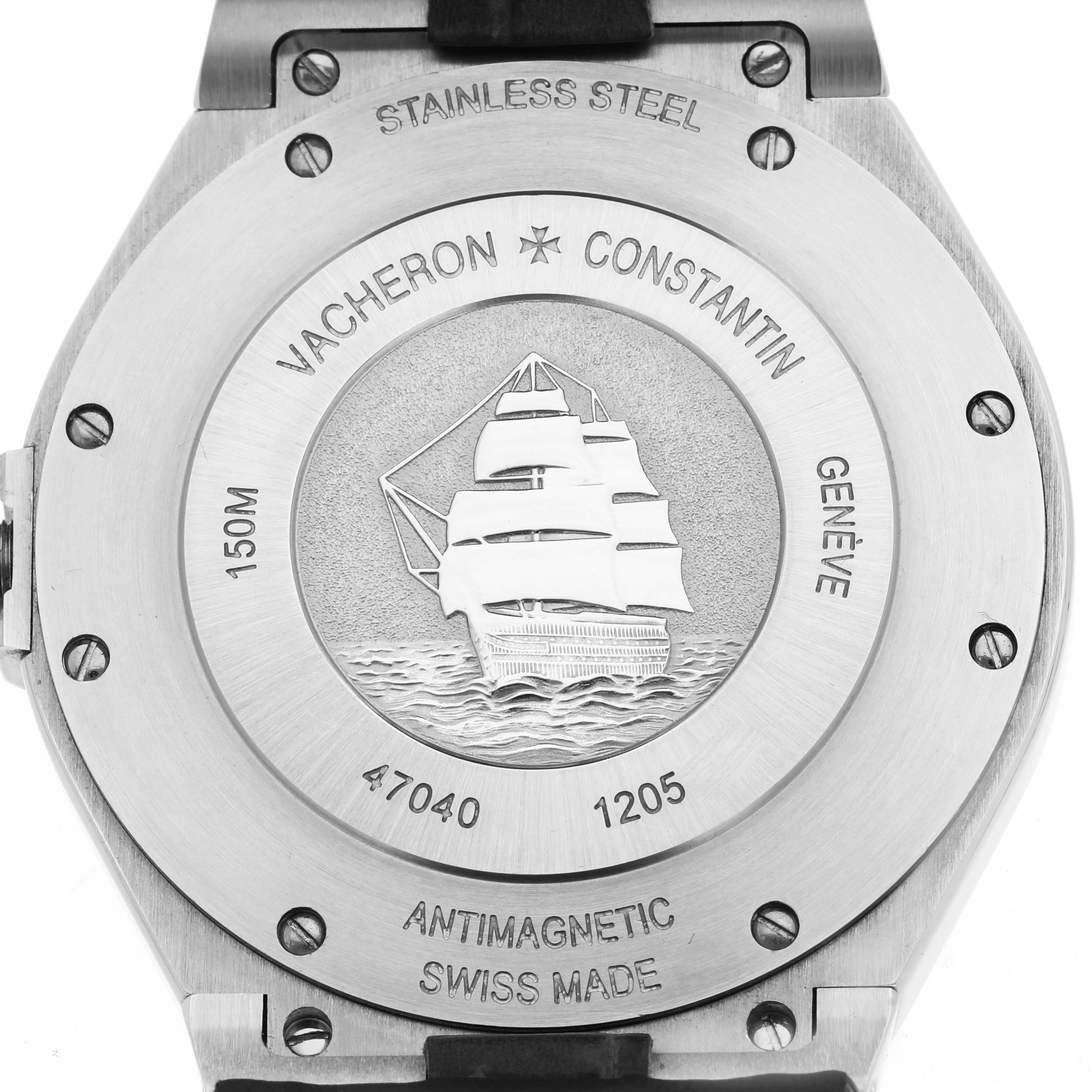 The image shows the case back of the Vacheron Constantin Overseas model 47040, featuring a ship engraving and inscriptions like "Stainless Steel" and "Antimagnetic Swiss Made."