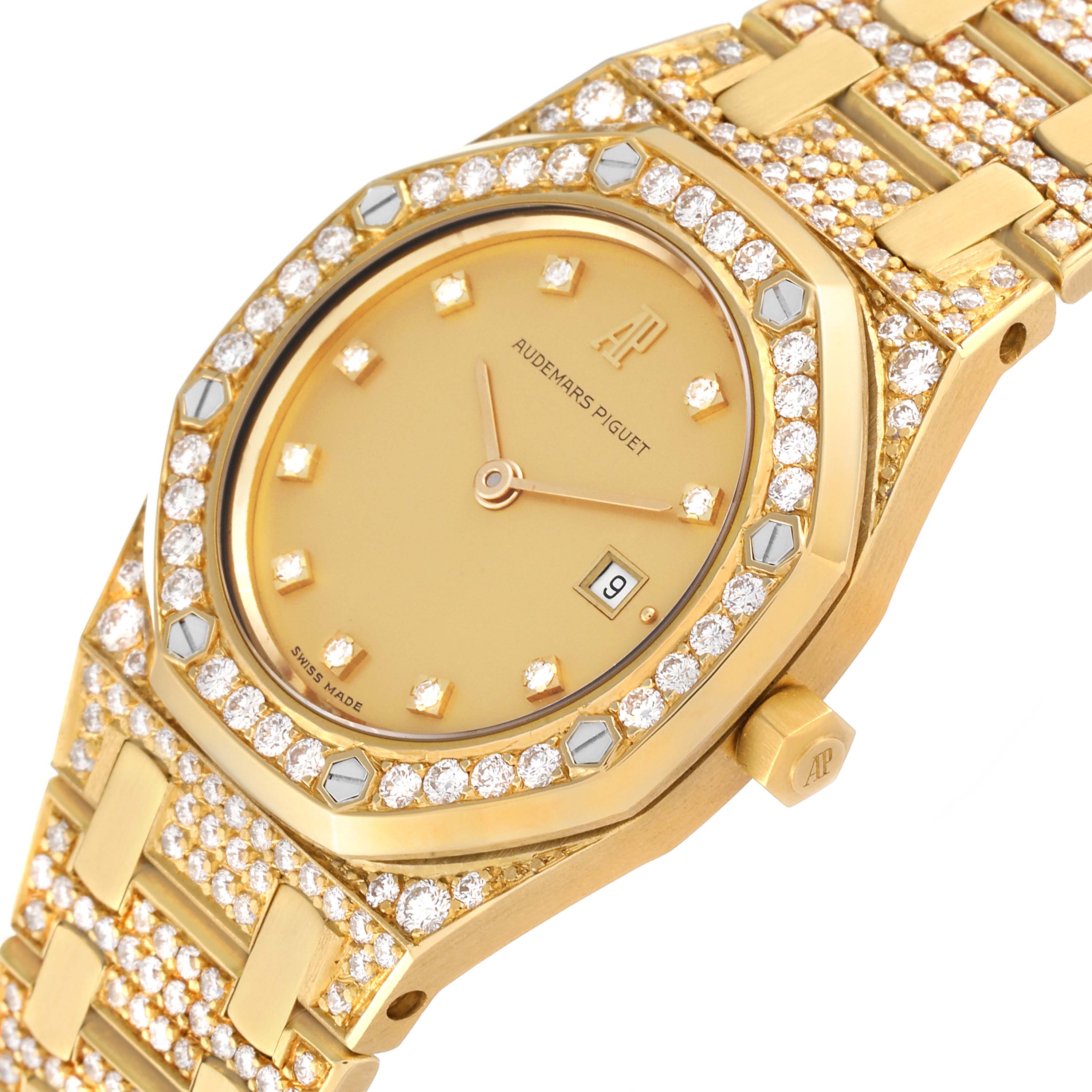 The image shows a close-up angled view of the Audemars Piguet Royal Oak Women's Yellow Gold Champagne Dial Women's Yellow Gold Champagne Dial watch, featuring a diamond-encrusted bezel, dial, and bracelet.
