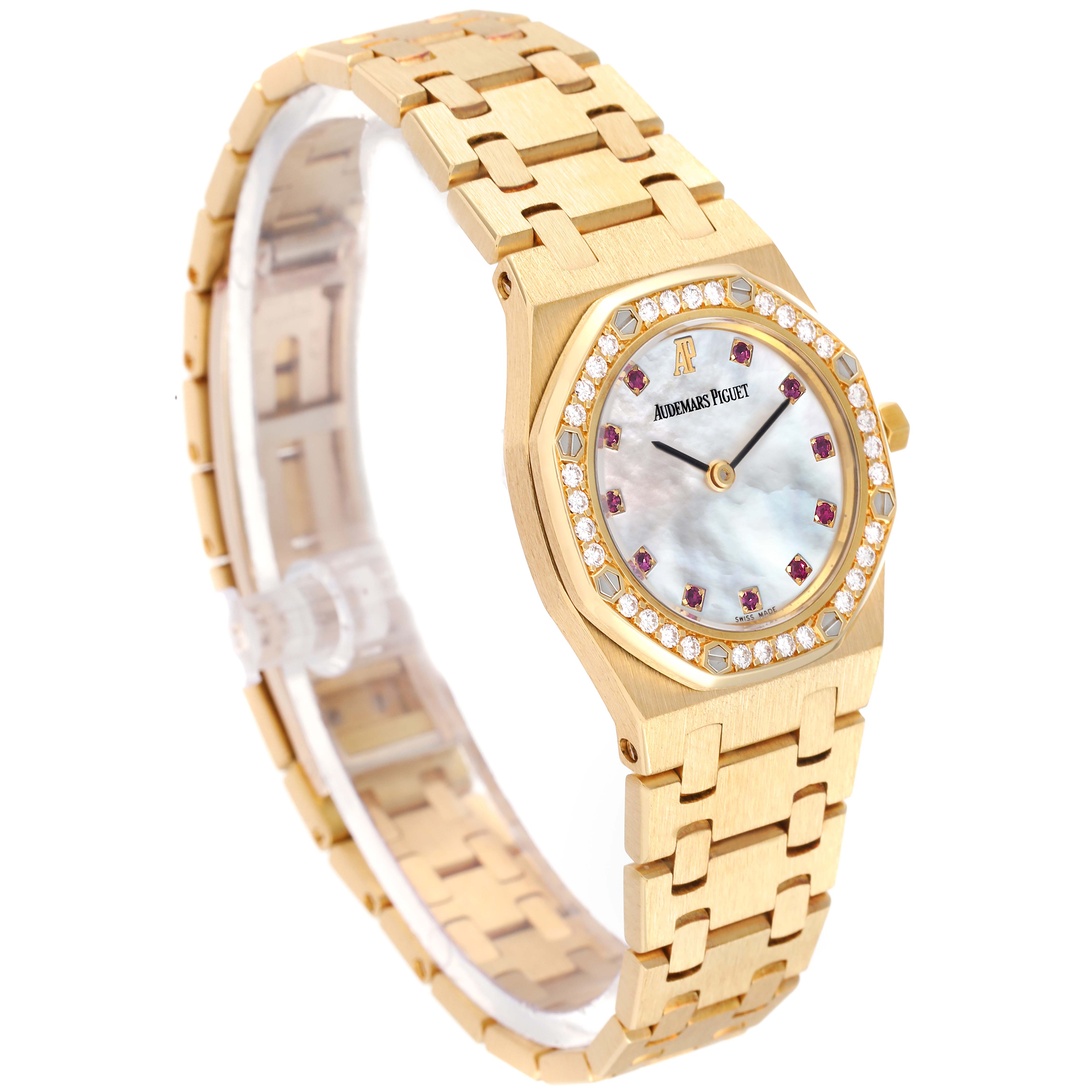 The image displays an Audemars Piguet Royal Oak 66344BA Women's Yellow Gold Mother of Pearl Dial 66344BA Women's Yellow Gold Mother of Pearl Dial watch at an angled view, showcasing the bracelet, case, and dial with gemstones.