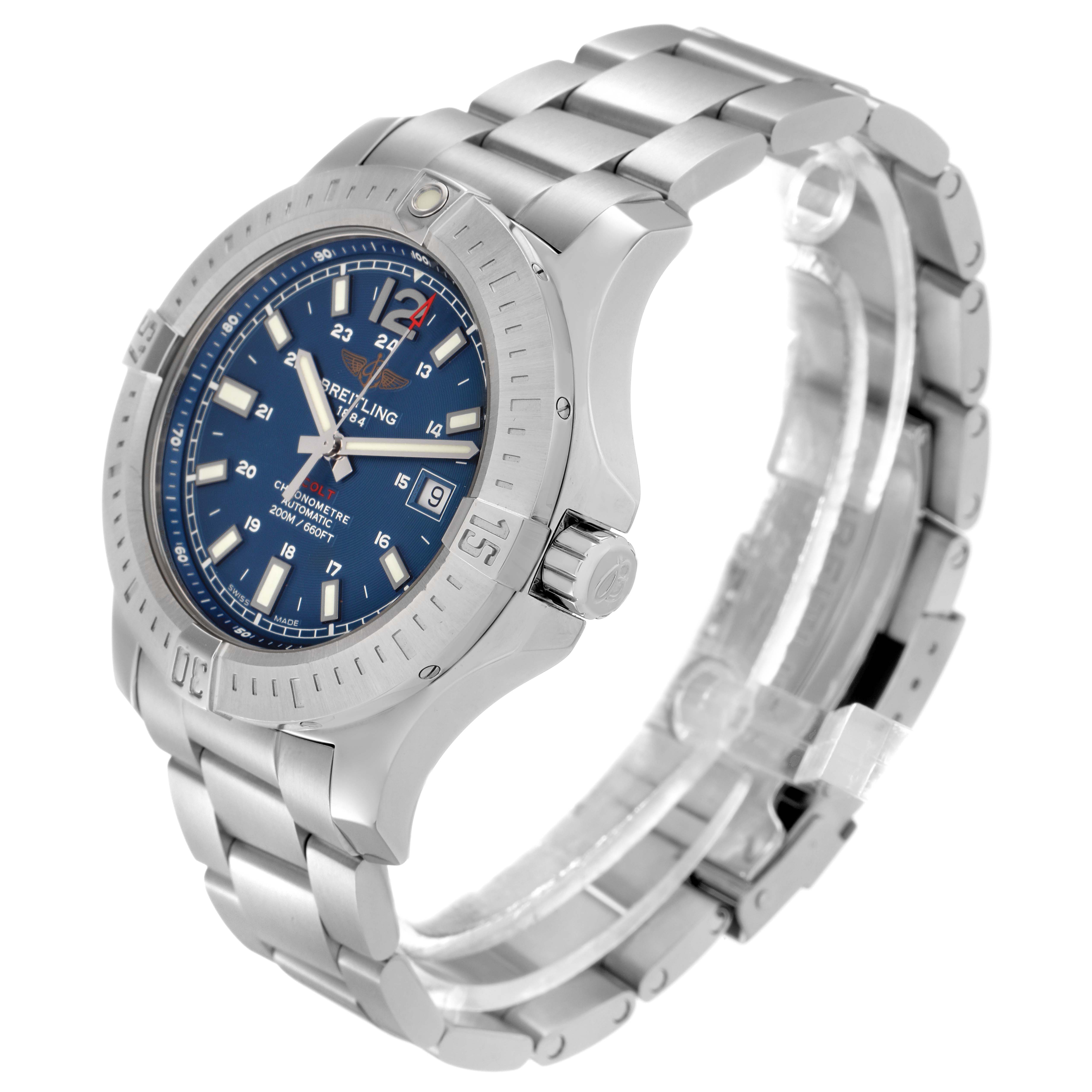 The image shows a Breitling Colt A17388 men's watch at a slight angle, highlighting the blue dial, bezel, crown, and stainless steel bracelet.