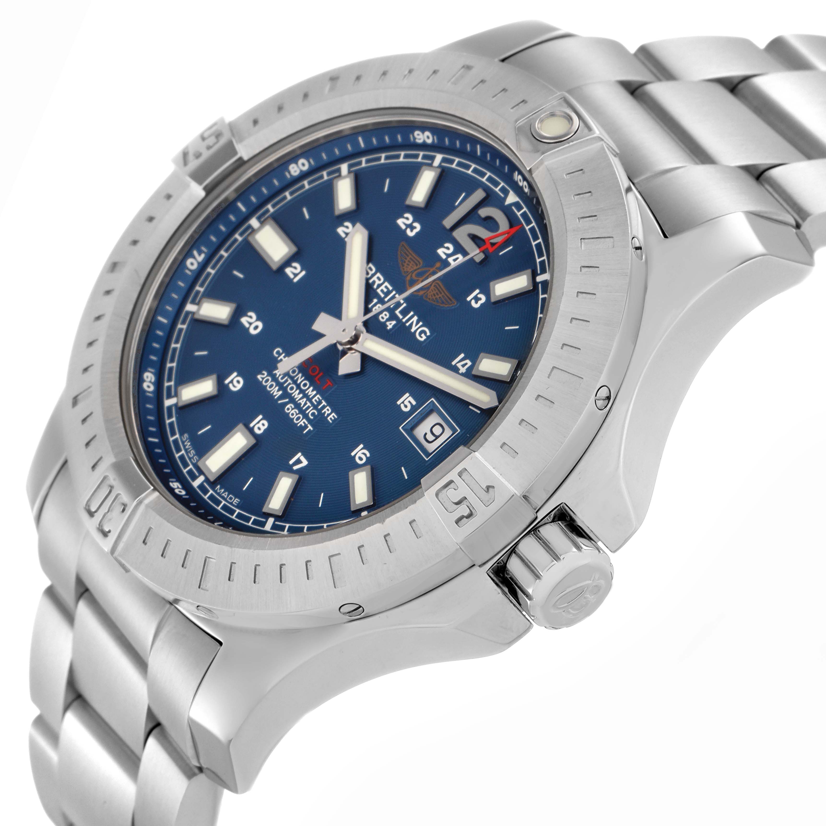The image shows a Breitling Colt model number A17388 men's watch at a three-quarter angle, highlighting the blue dial, bezel, crown, and stainless steel bracelet.