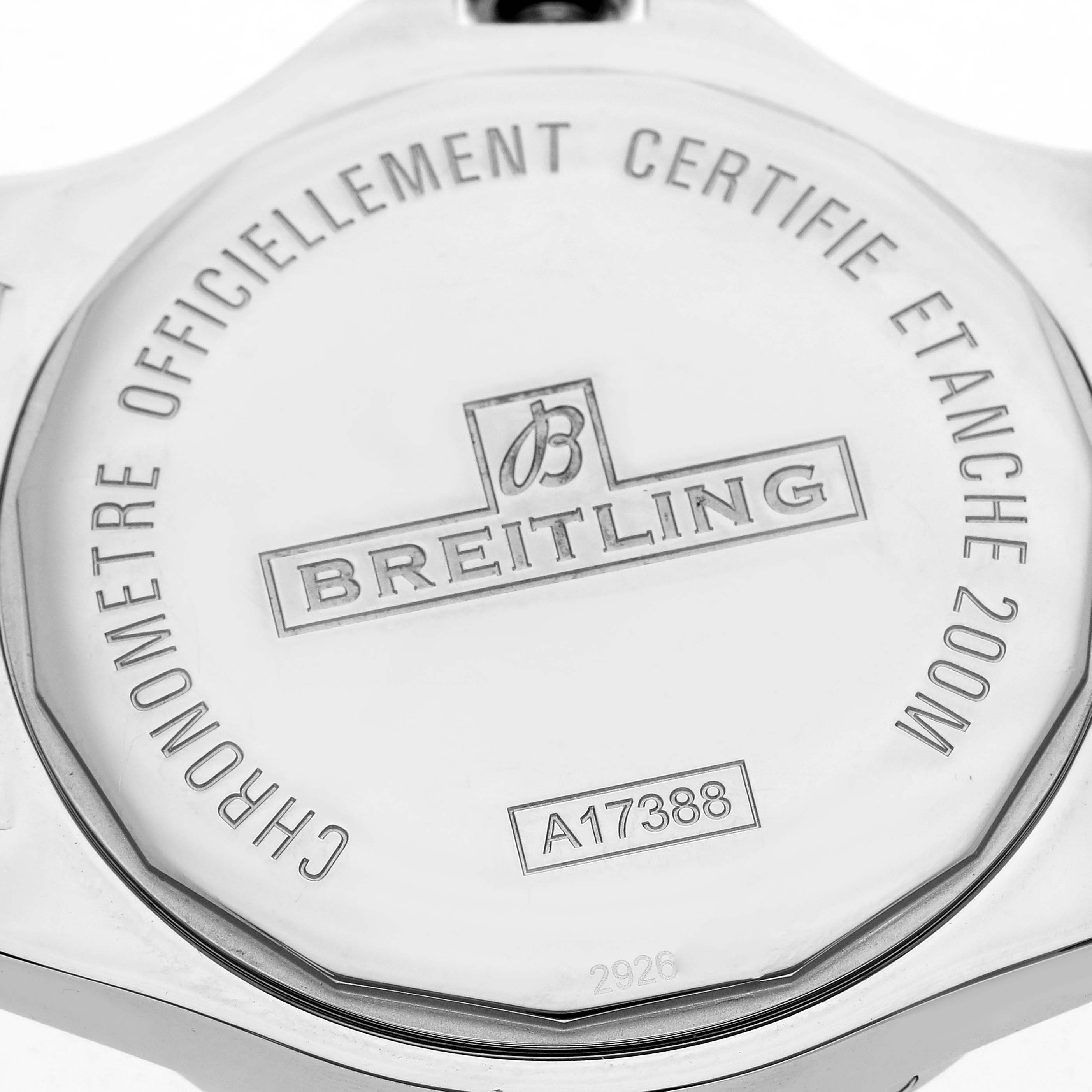 The image shows the back case of a Breitling Colt watch, model number A17388, with engravings displaying branding and specifications.