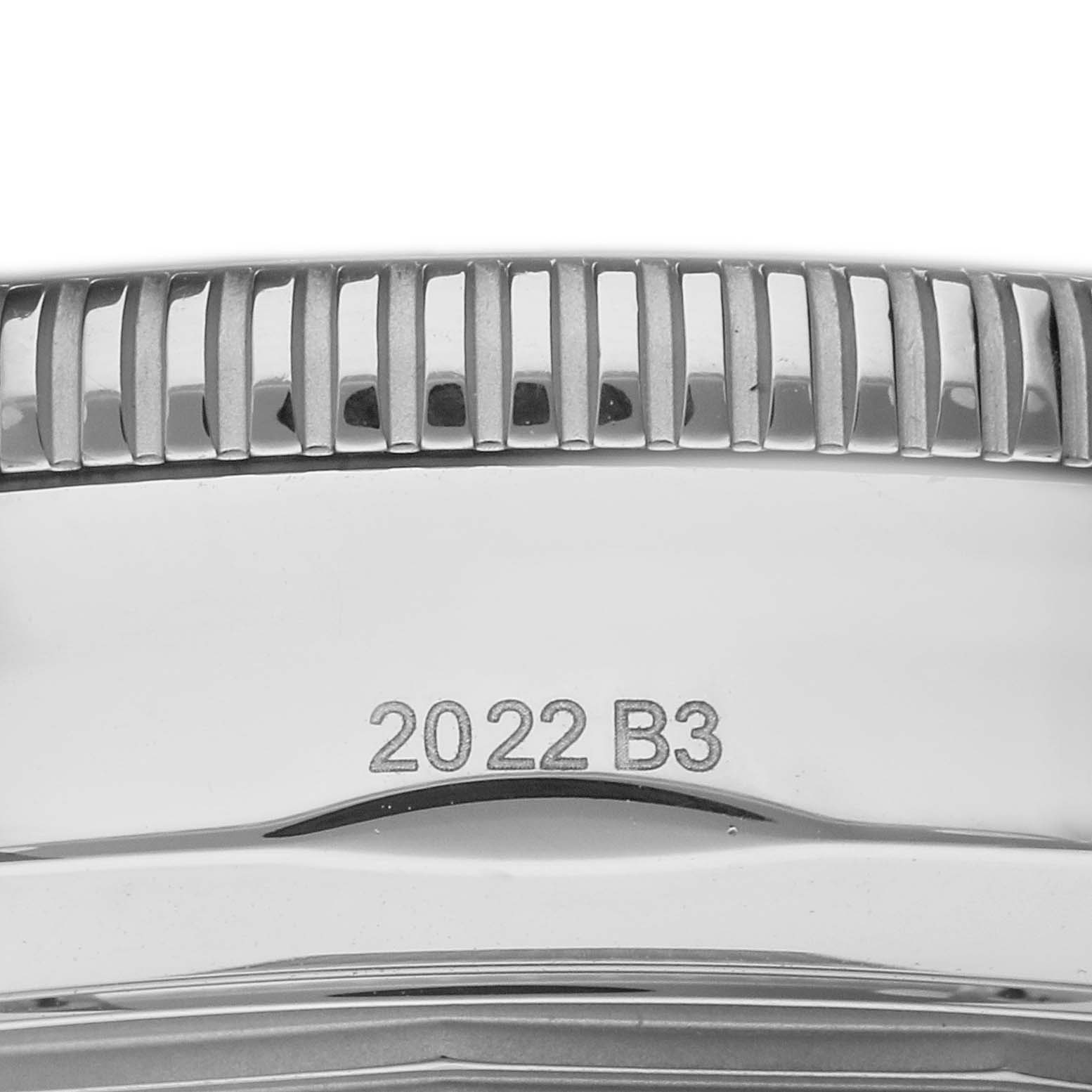 The image shows a close-up of the side of the Breitling Superocean men's watch, model AB2030161C1A1, focusing on the bezel with engraved ridges and the model number.