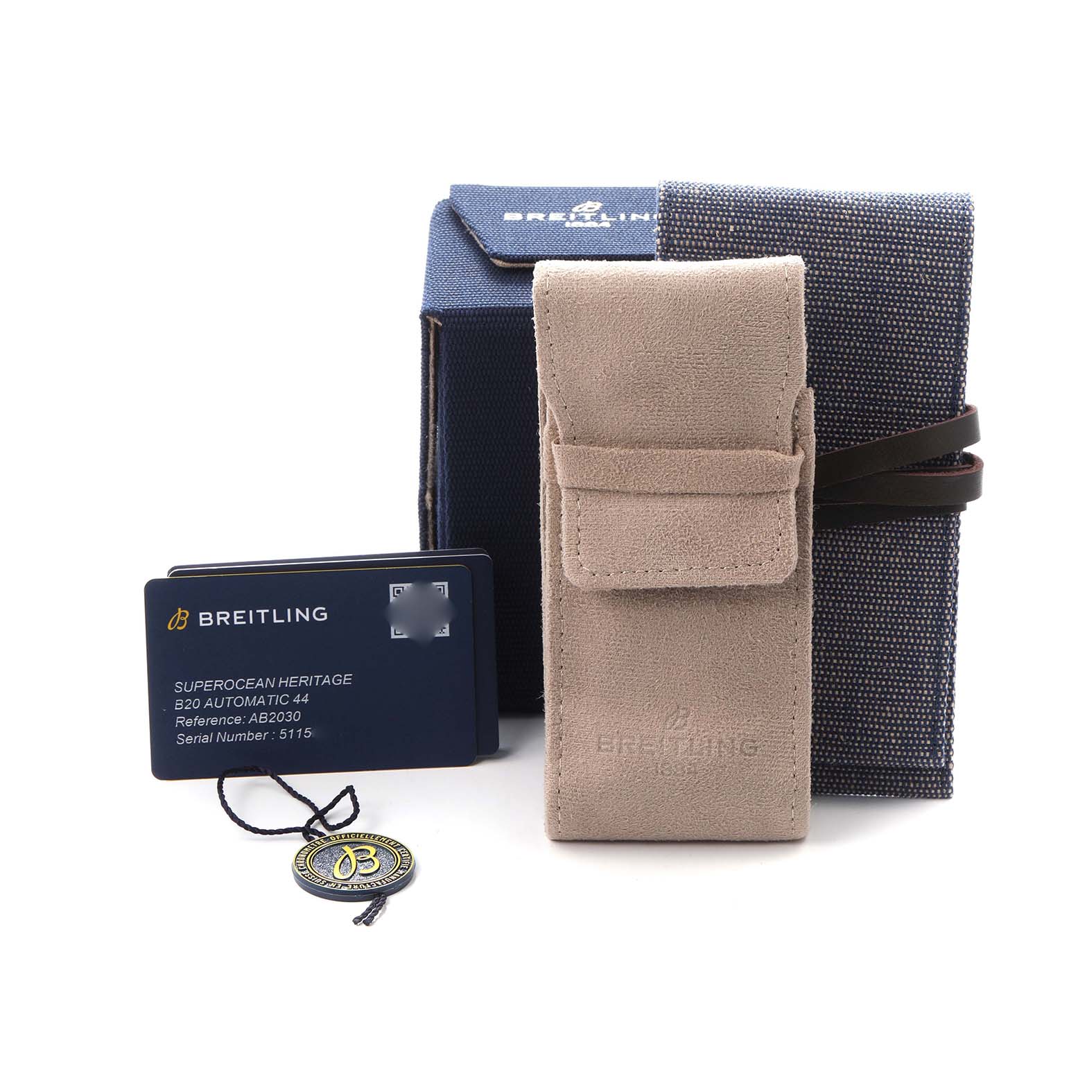 The image shows a beige suede pouch and a blue box for a Breitling Superocean model AB2030161C1A1, along with a warranty card and tag.