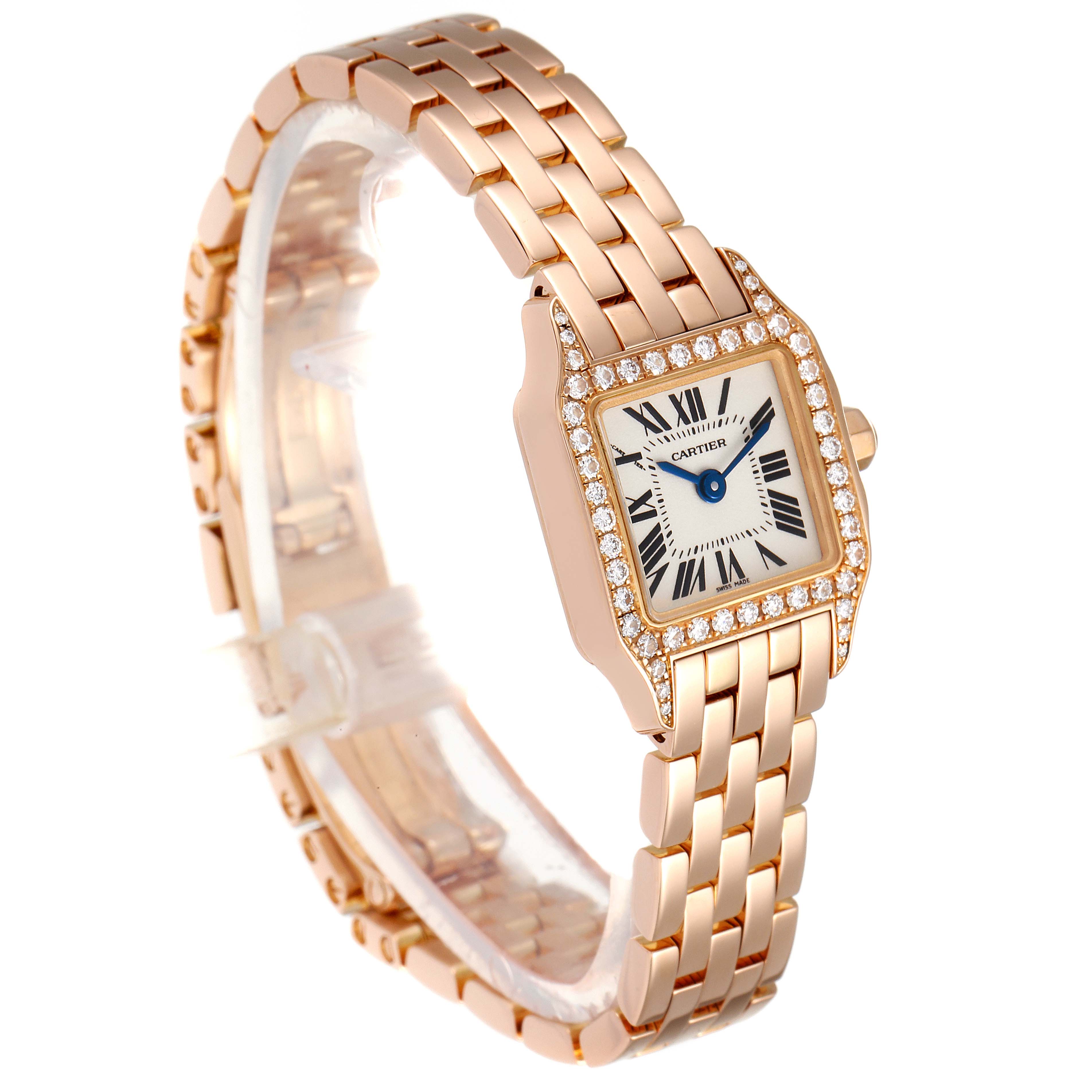 This Cartier Santos Demoiselle WF9011Z8 Women
s Rose Gold Silver Dial WF9011Z8 Women
s Rose Gold Silver Dial watch is shown at an angled side view, revealing the face, band, and bezel adorned with diamonds.