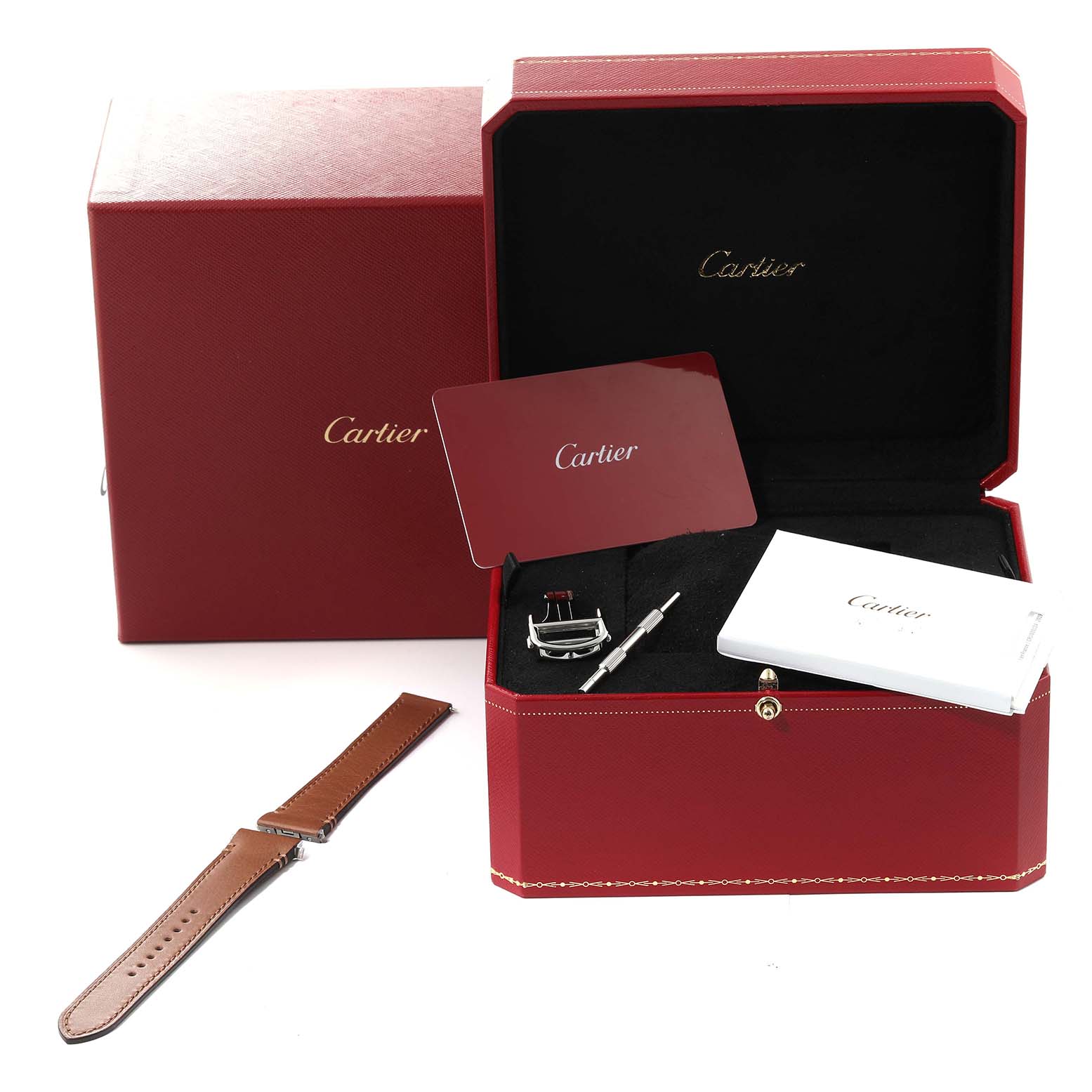 The image shows a Cartier Santos W2SA0016 Men
s Steel and Gold (two tone) Silver Dial W2SA0016 Men
s Steel and Gold (two tone) Silver Dial watch case, extra strap, tools, warranty card, and documentation, all at a slightly elevated angle.