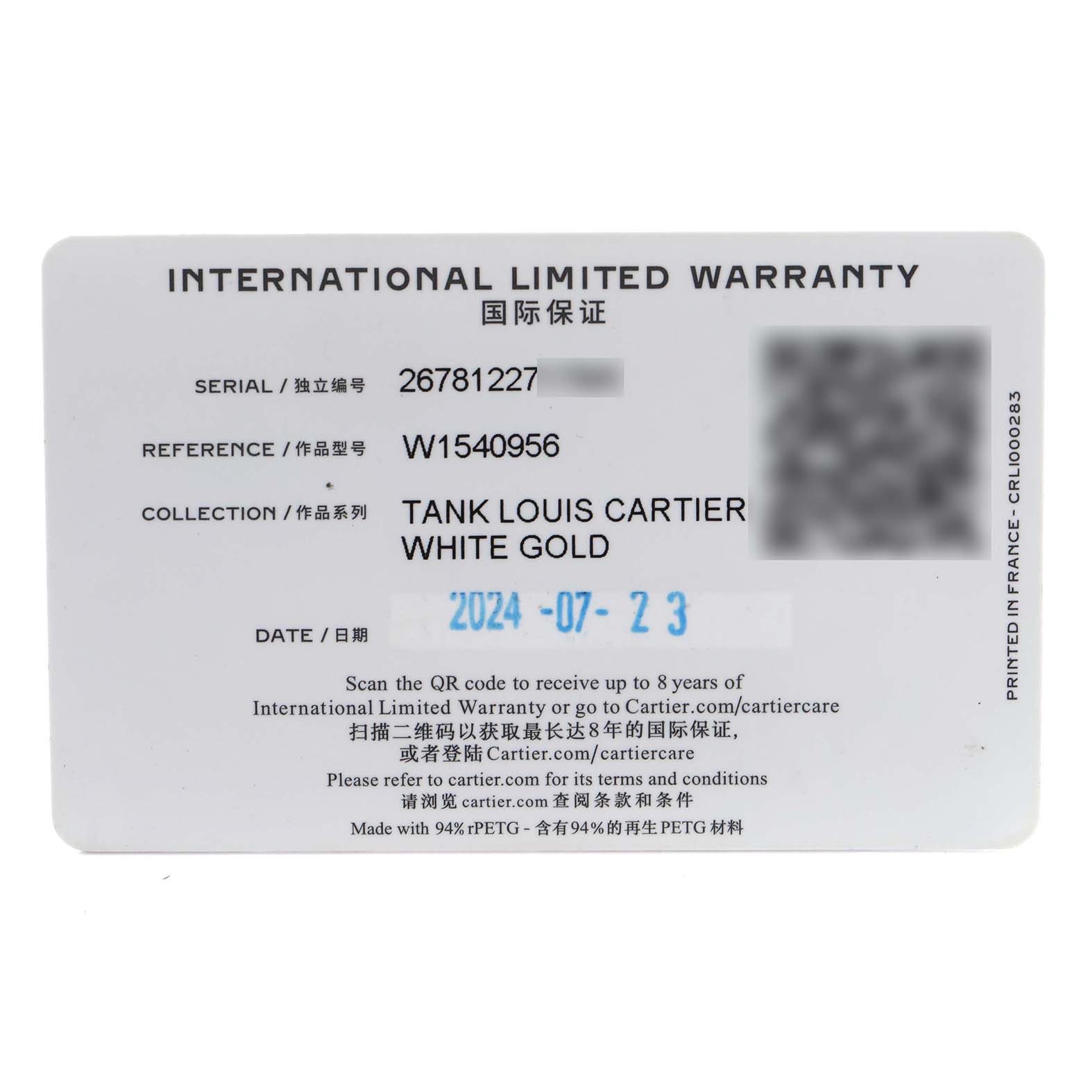 The image shows an international limited warranty card for the Cartier Tank Louis model, number W1540956.