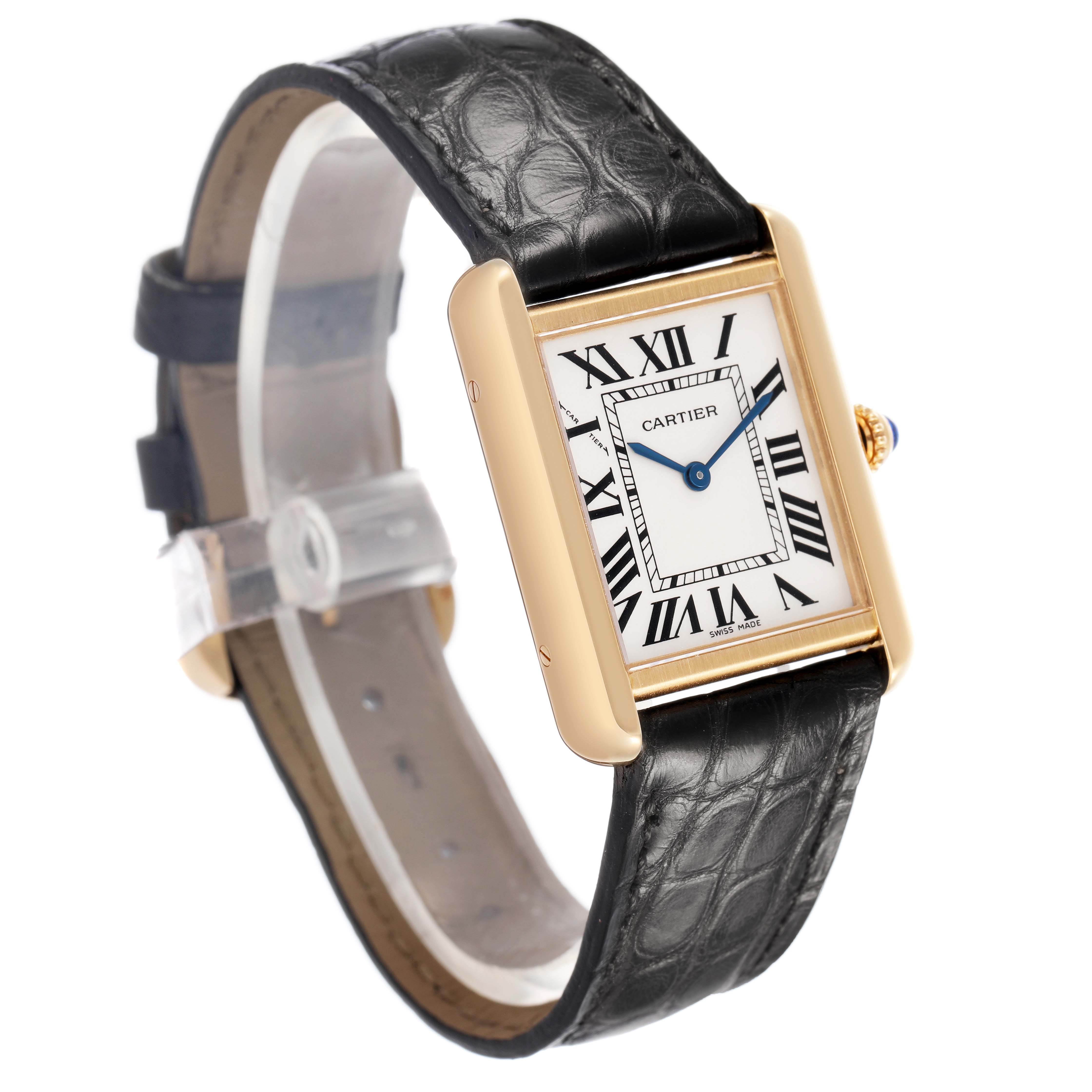 The Cartier Tank Solo W1018755 Women's Yellow Gold Silver Dial watch is shown from a slight angle, highlighting the face, leather strap, and gold case.