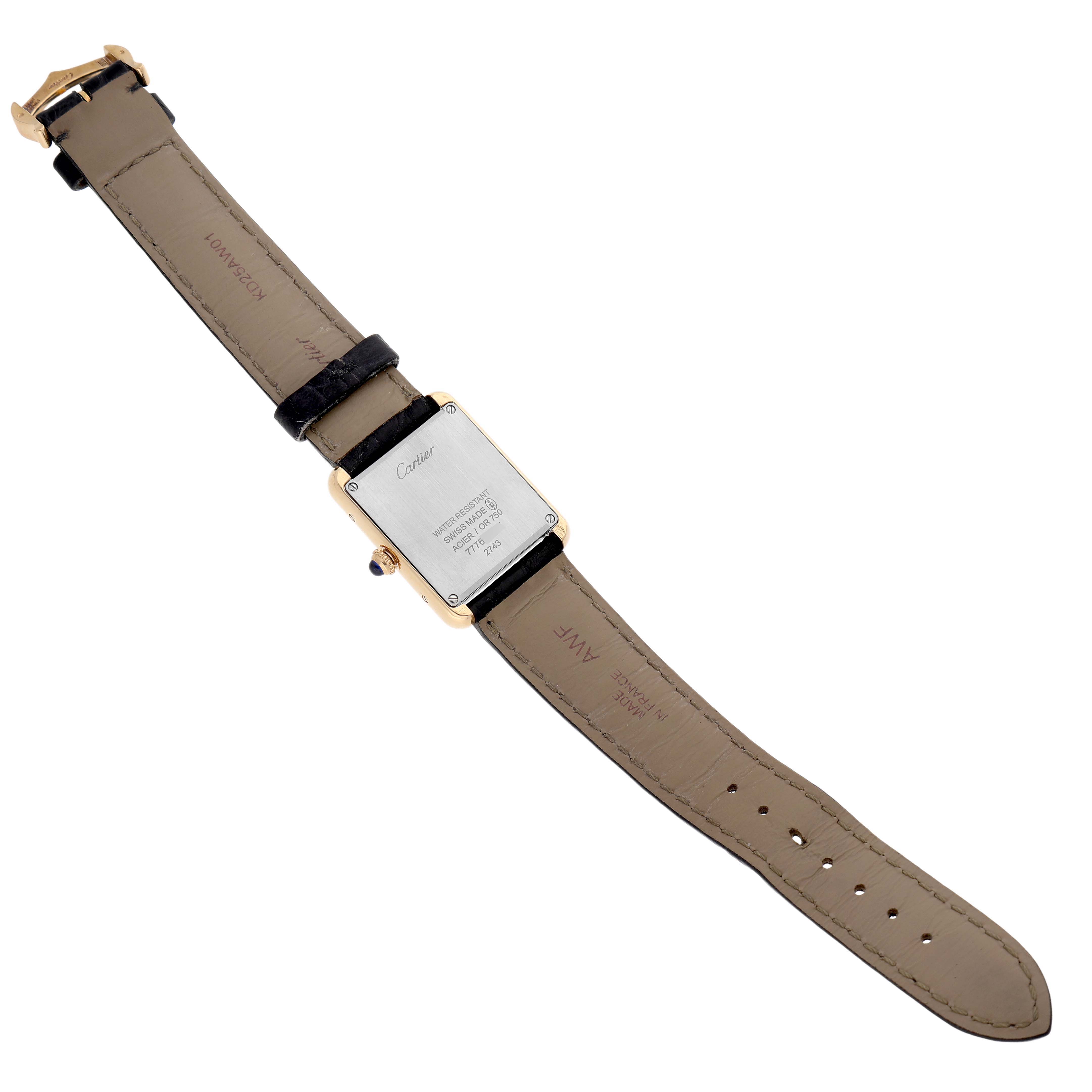 The image shows the back of a Cartier Tank Solo W1018755 Women's Yellow Gold Silver Dial watch, highlighting the case and strap from a top-down angle.