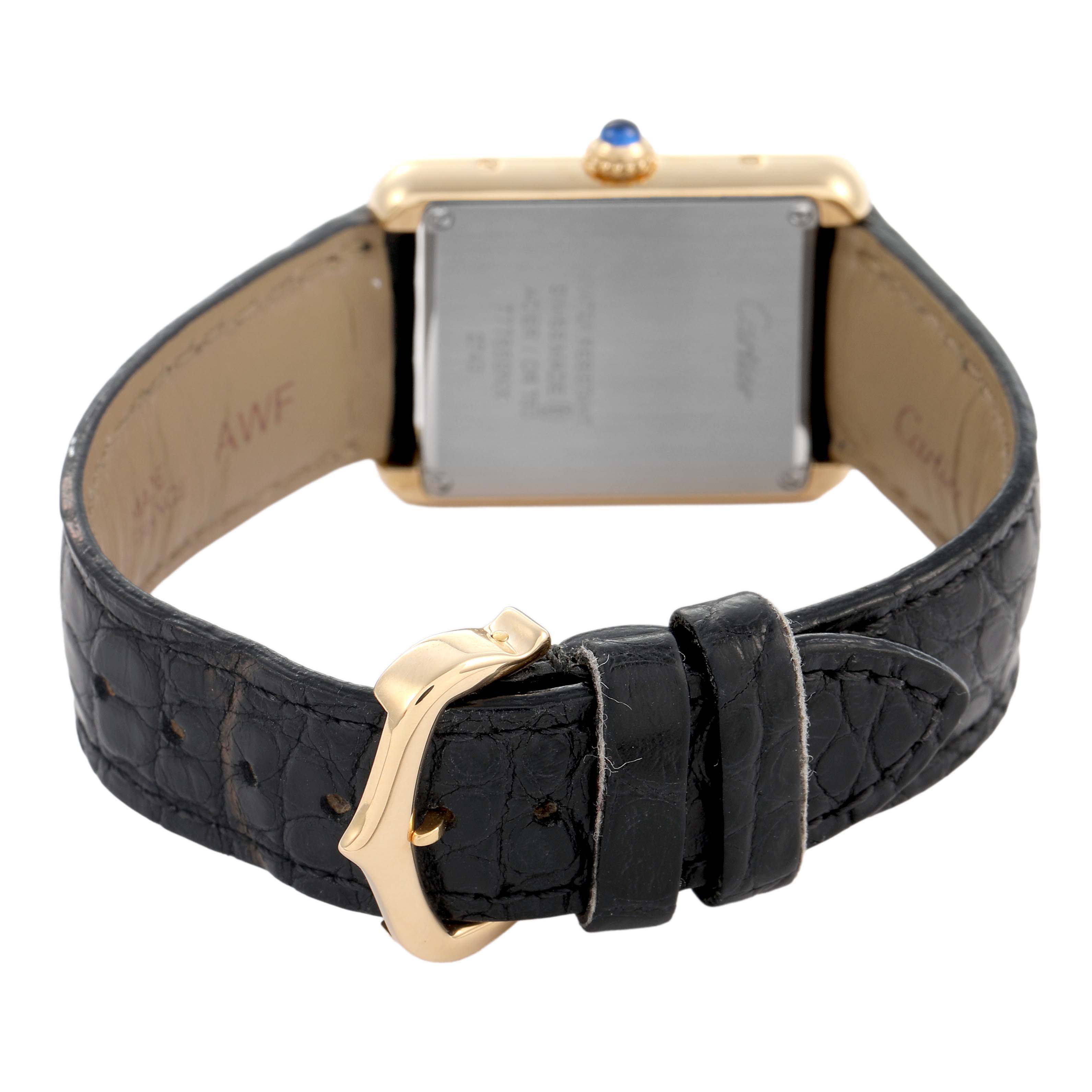 The image shows the back of the Cartier Tank Solo W1018755 Women's Yellow Gold Silver Dial watch, highlighting the case back, buckle, and leather strap.