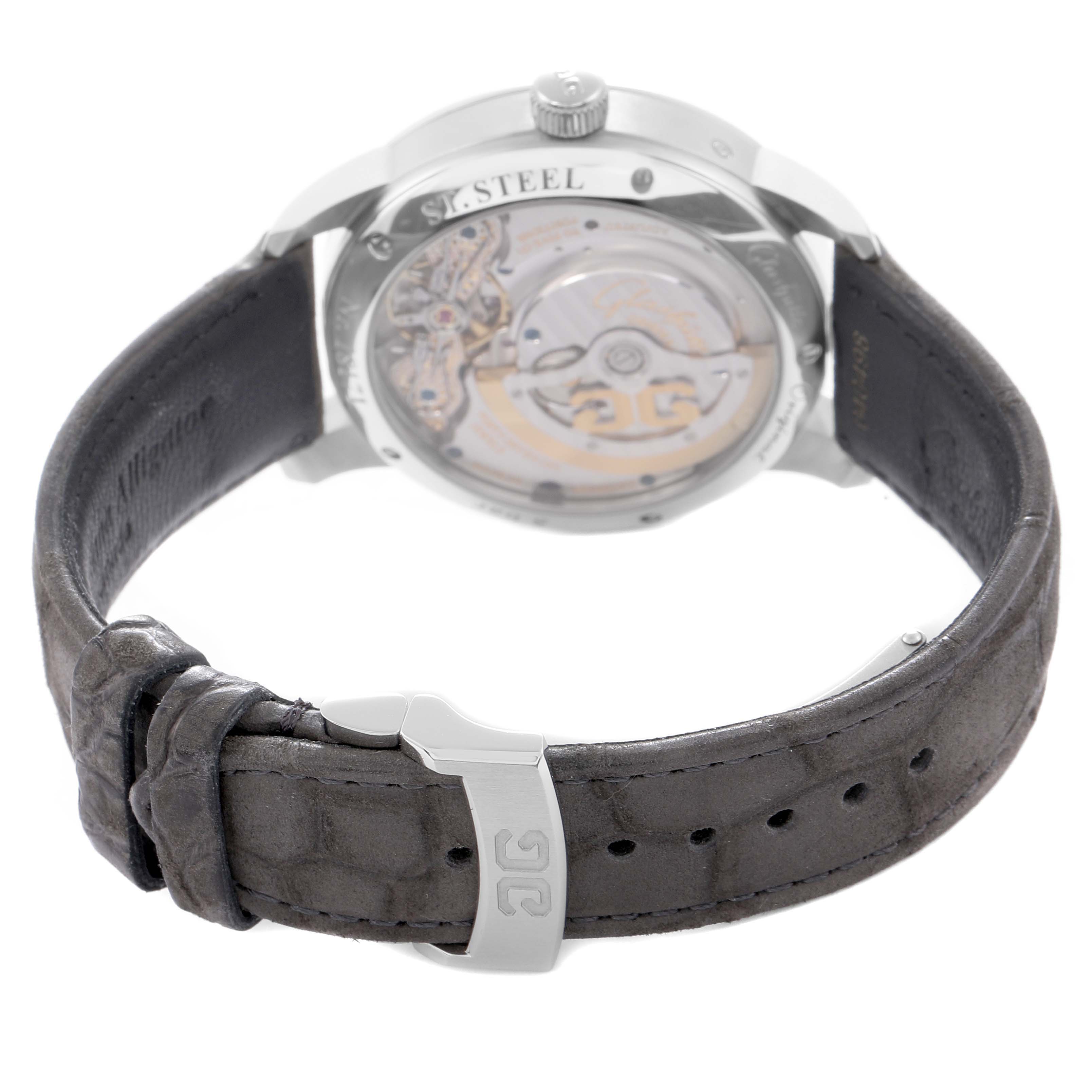 The photo shows a Glashütte Pano watch model 1-90-02-43-32-05 from the back, highlighting the caseback and movement with a partial view of the leather strap.