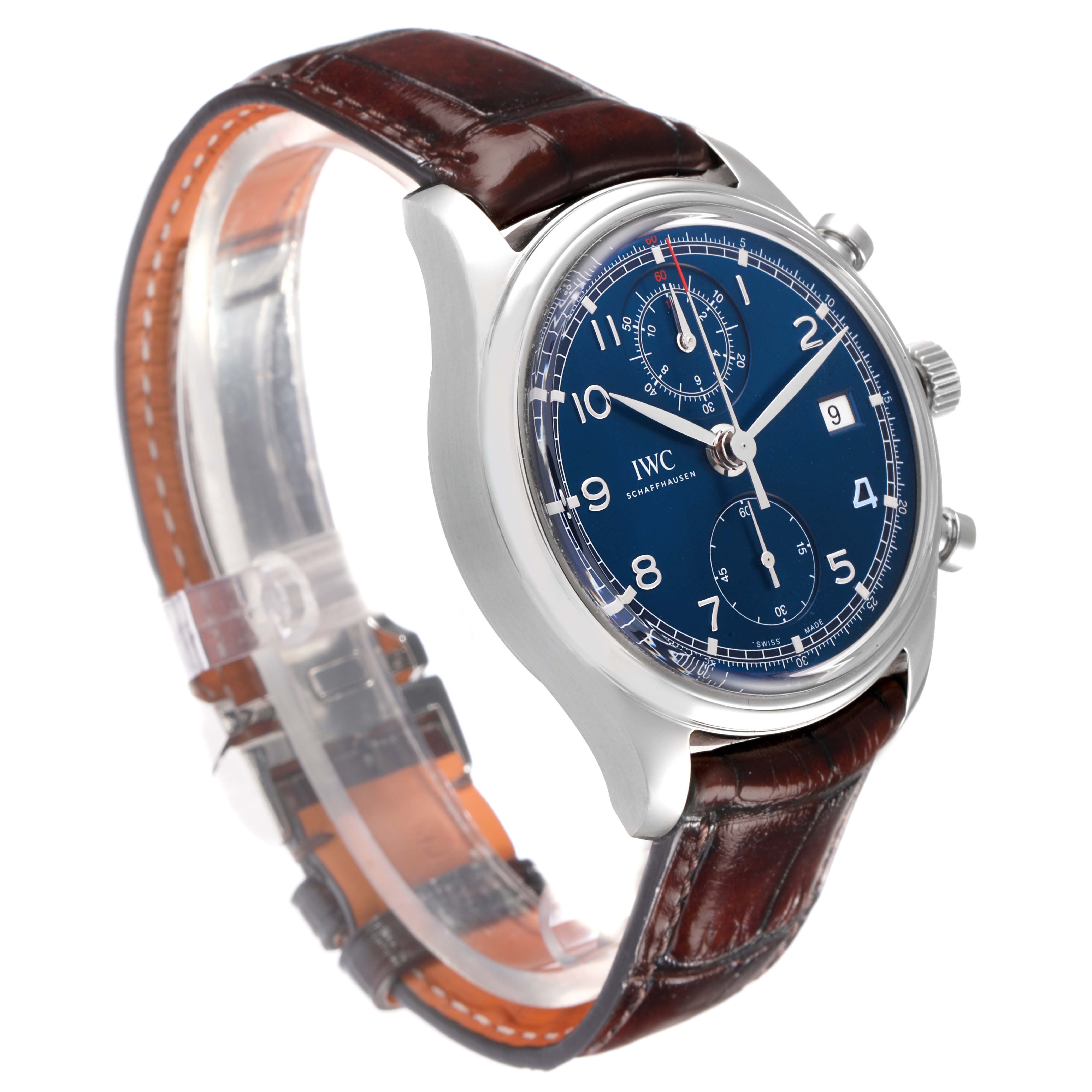 The image shows an IWC Portuguese IW390406 men's watch at an angled view, highlighting its blue dial, chronograph subdials, silver casing, and brown leather strap.