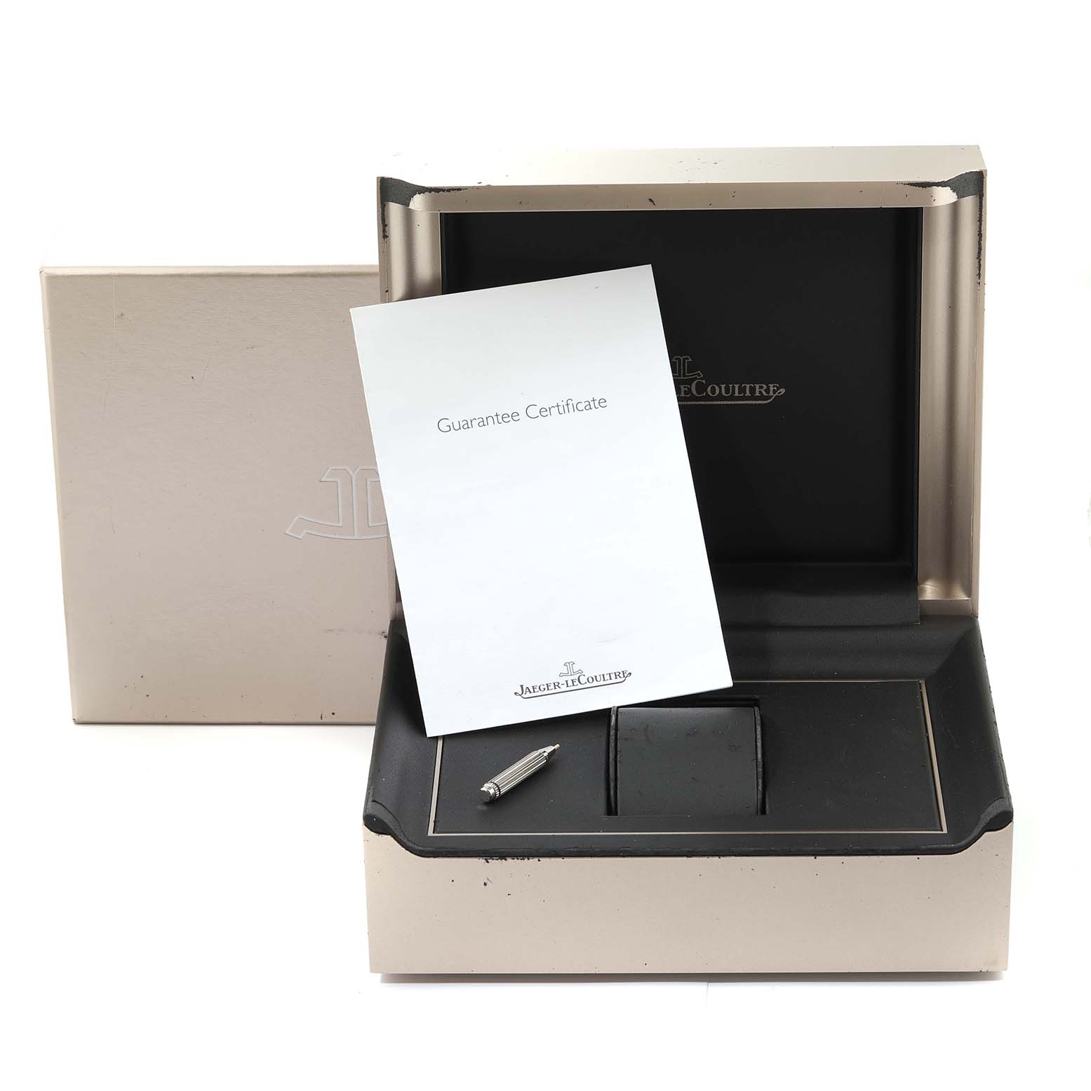 This image shows the packaging, guarantee certificate, and tool for a Jaeger LeCoultre Master Q151812A Men's Stainless Steel Silver Dial Q151812A Men's Stainless Steel Silver Dial model watch from a front angle.