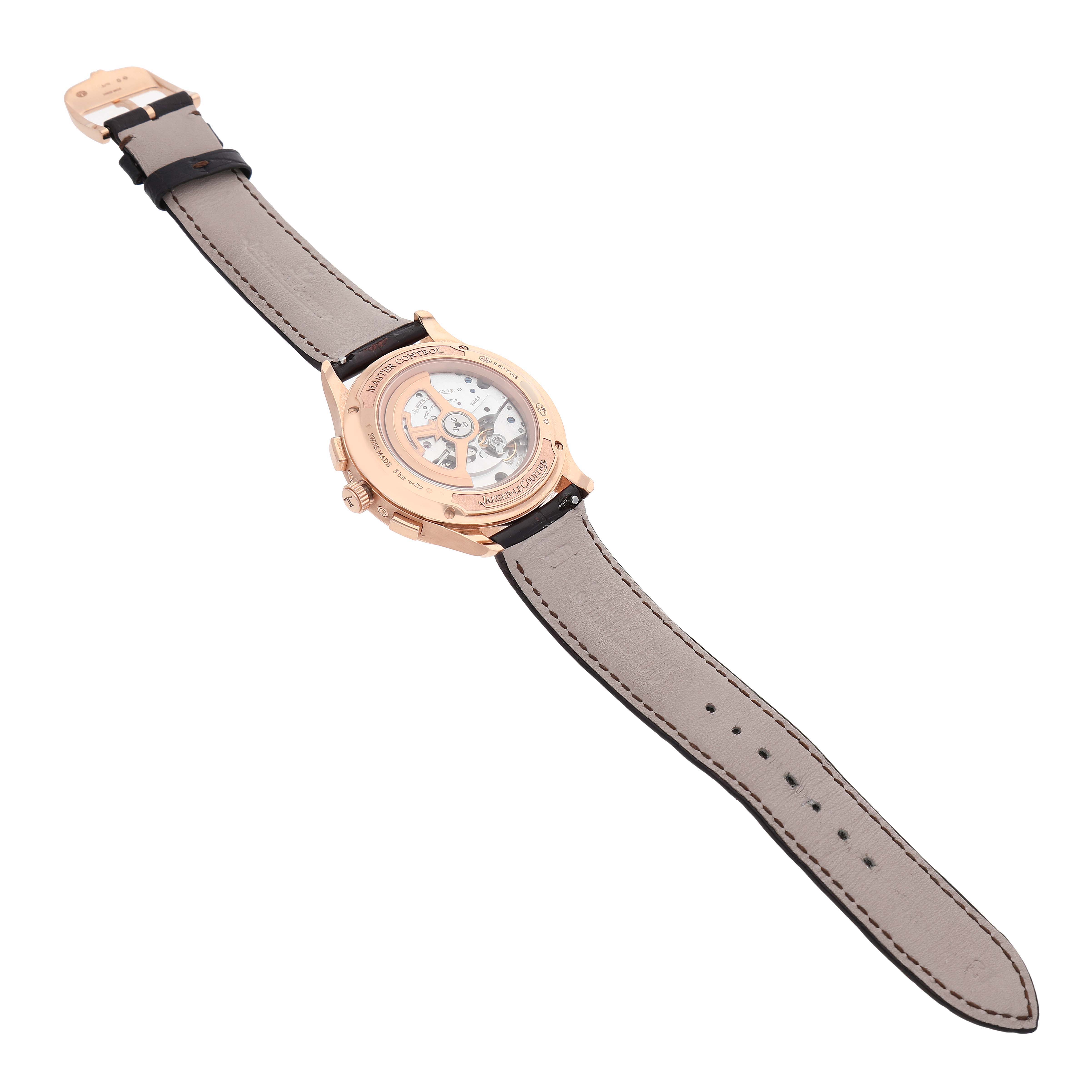 The image shows the back view of a Jaeger LeCoultre Master Q4132520 Men's Rose Gold Silver Dial model, highlighting its exhibition case back and strap.