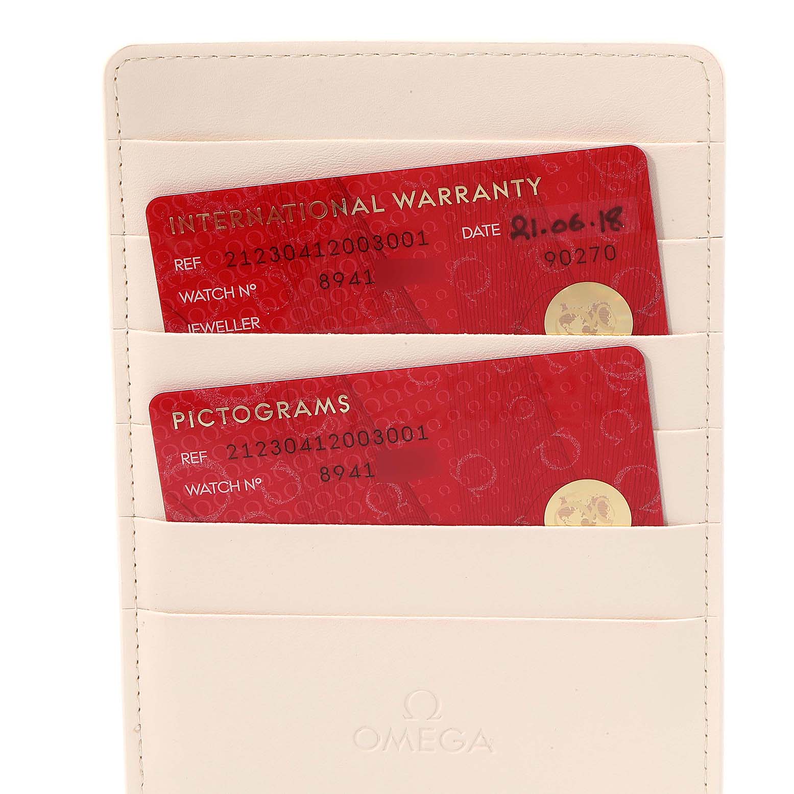 This image shows international warranty and pictogram cards for an Omega Seamaster 212.30.41.20.03.001 Men's Stainless Steel Blue Dial 212.30.41.20.03.001 Men's Stainless Steel Blue Dial, placed inside a white cardholder.