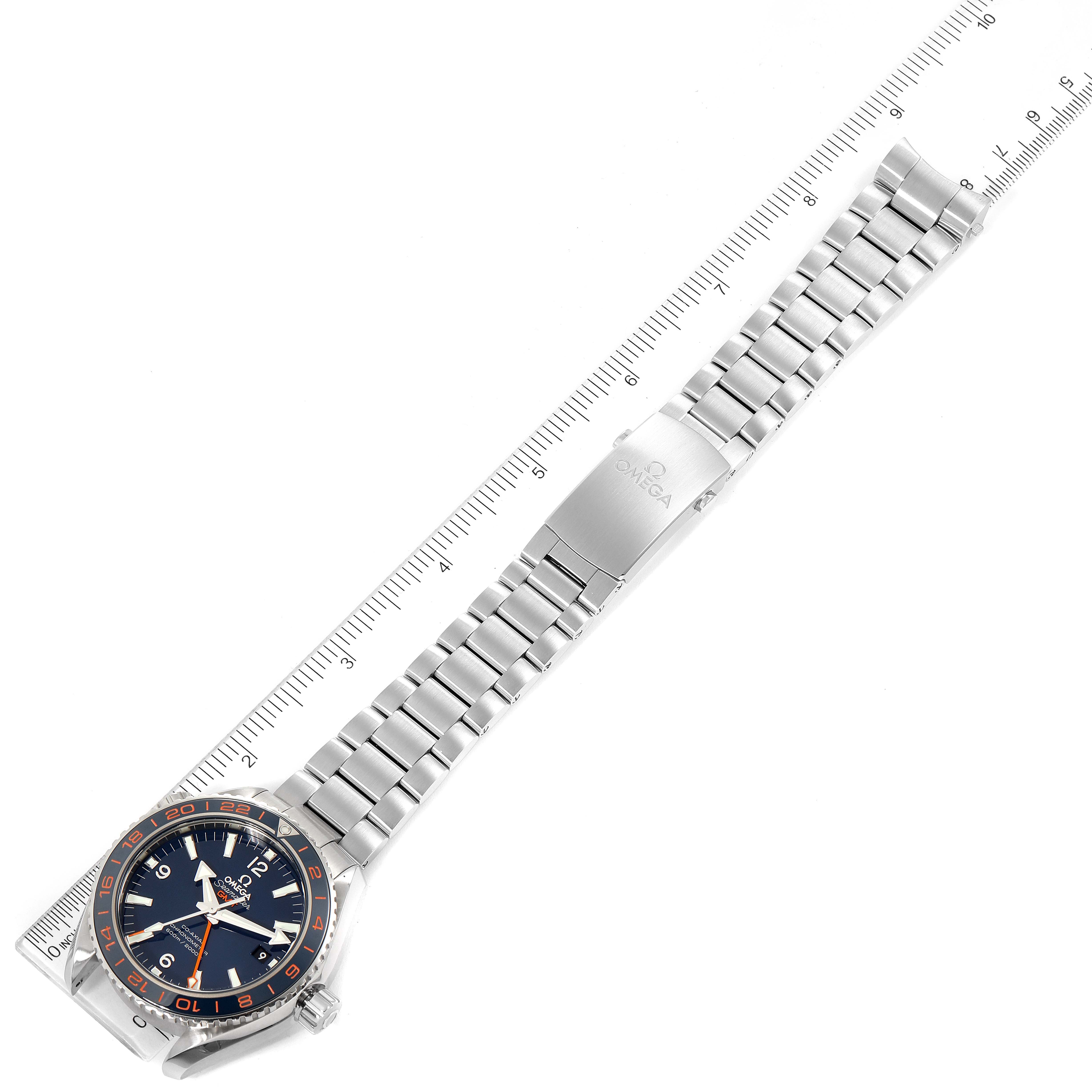 The image shows an Omega Planet Ocean 232.30.44.22.03.001 Men's Stainless Steel Blue Dial 232.30.44.22.03.001 Men's Stainless Steel Blue Dial watch from an overhead angle, highlighting its metal bracelet and clasp.