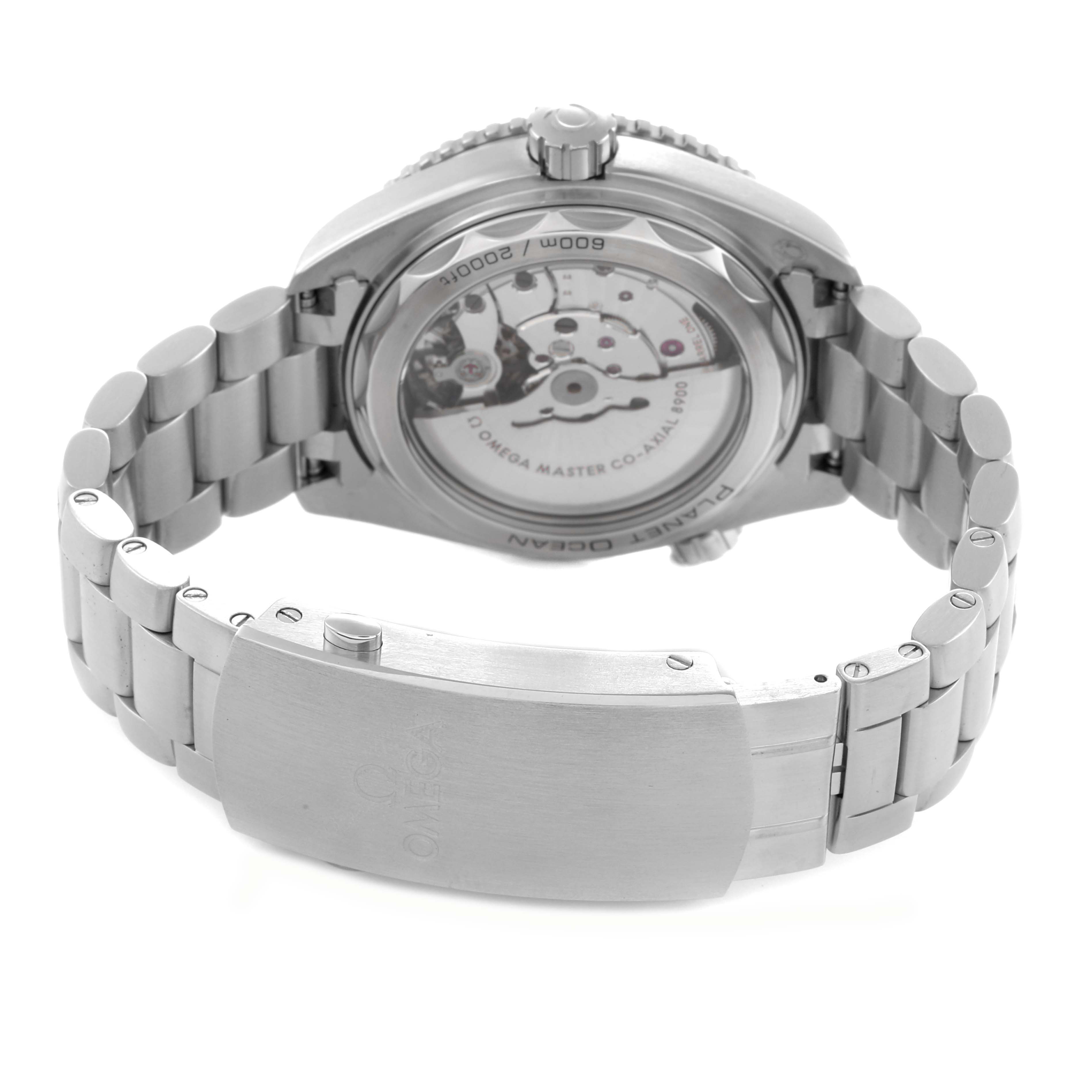 The Omega Planet Ocean model 215.30.44.21.01.001 is shown from a rear angle, highlighting the transparent case back and metal bracelet.