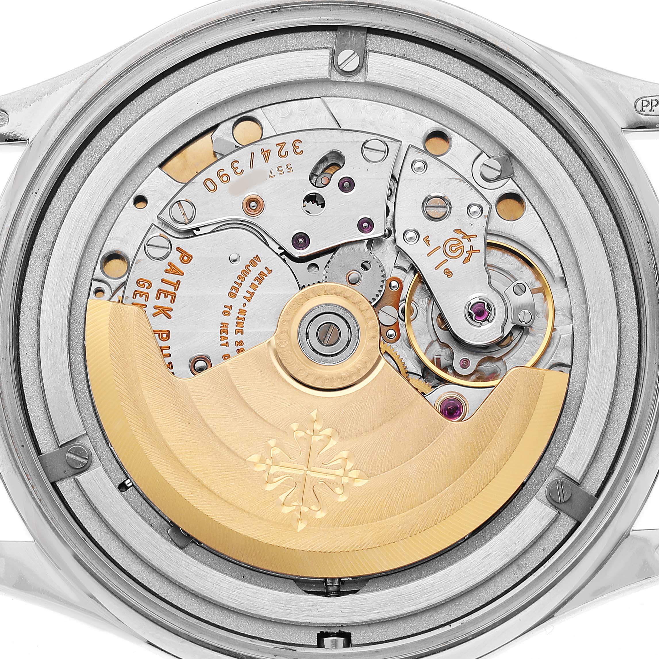The image shows the back view of a Patek Philippe Calatrava 5296G-010 Men's White Gold Silver Dial watch, highlighting its intricate movement and rotor.