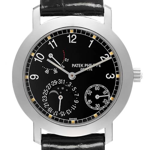 The image shows the face of a Patek Philippe Complications watch from a front angle, highlighting its black dial and multiple subdials.