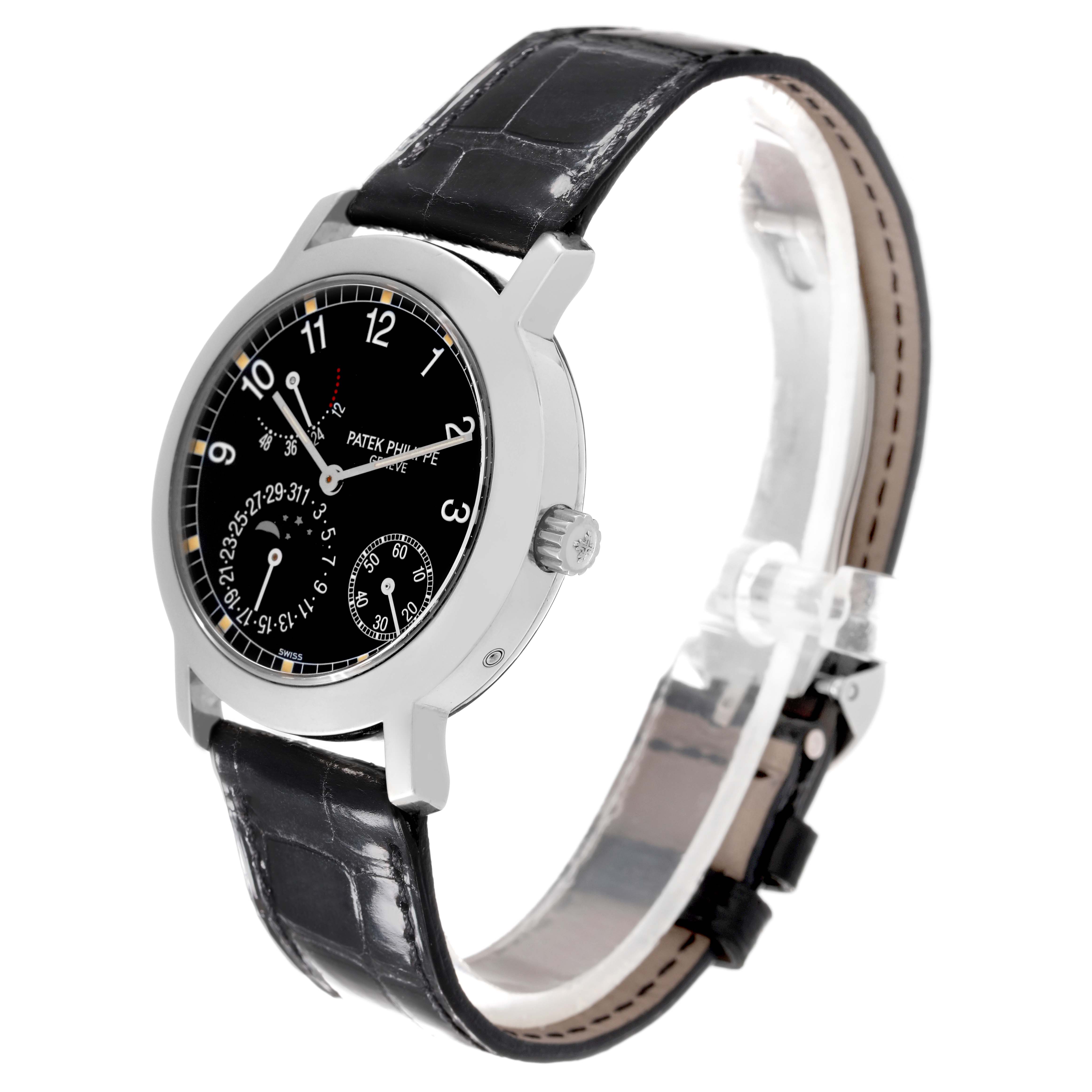 This image shows a side-angle view of the Patek Philippe Complications 5055G-010 Men's White Gold Black Dial 5055G-010 Men's White Gold Black Dial watch, highlighting the black dial, leather strap, and crown.