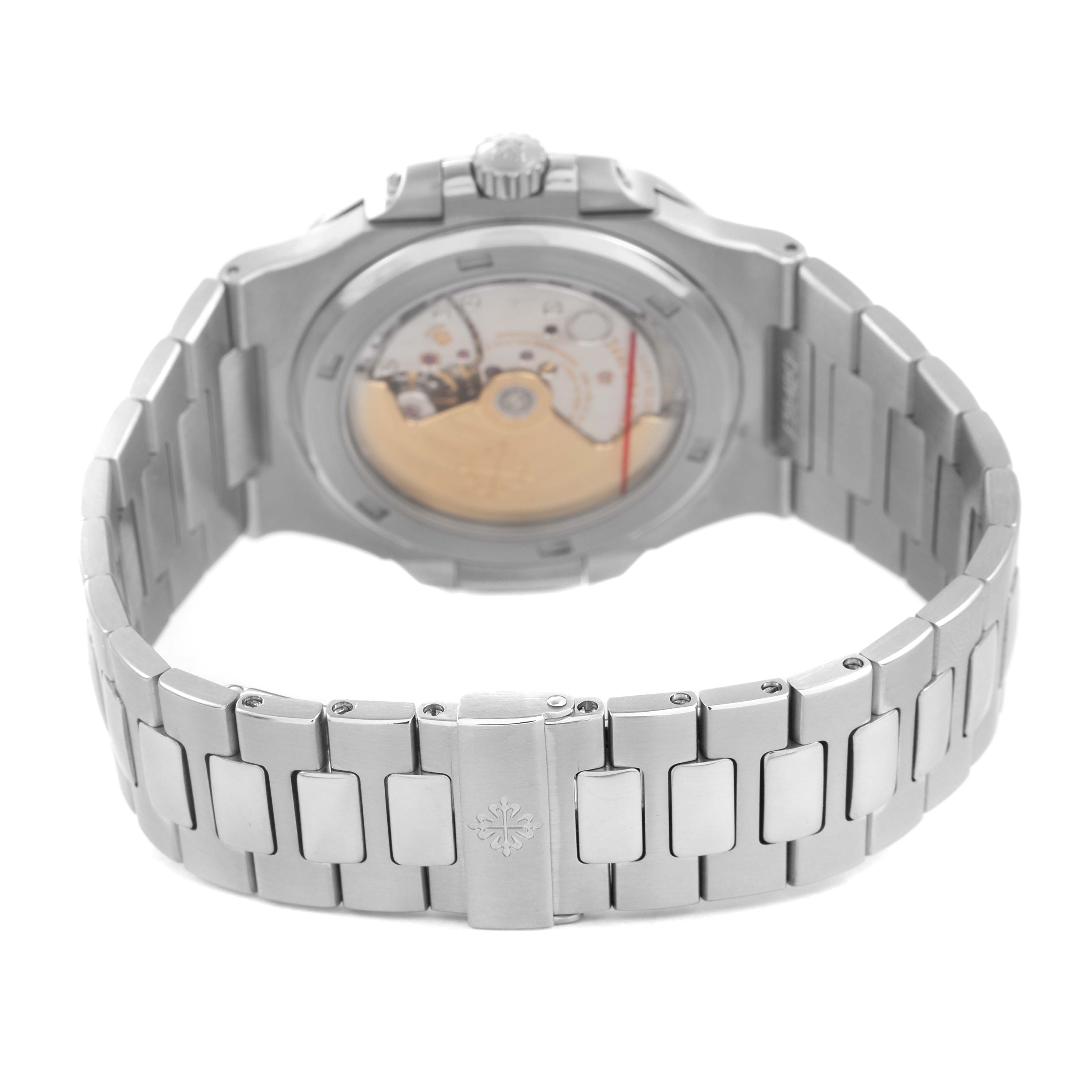 The image shows the back of a Patek Philippe Nautilus 5711/1A-001 Men's Stainless Steel Blue Dial watch, displaying the movement and metal bracelet.
