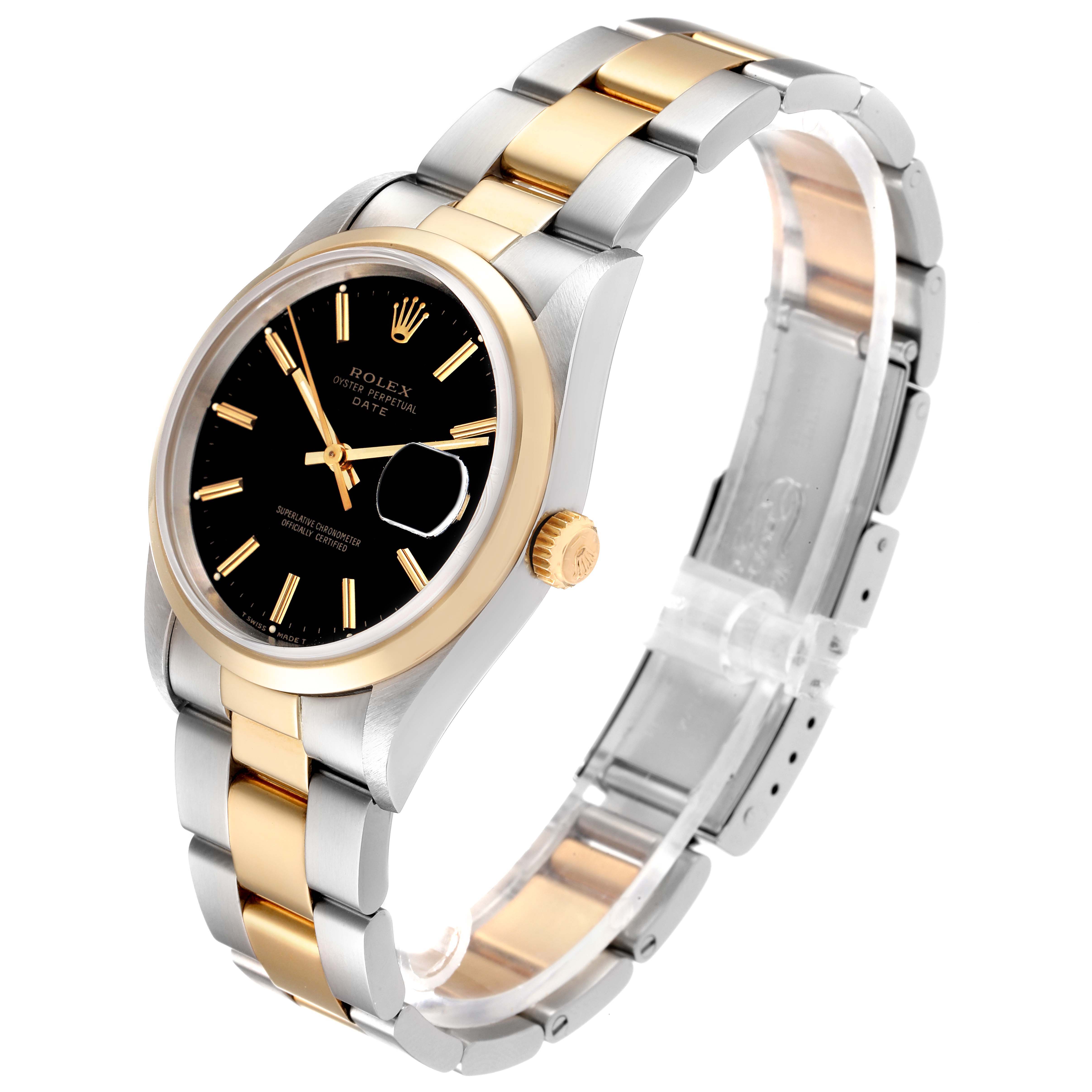 The image shows a Rolex Date 15203 Men's Steel and Gold (two tone) Black Dial 15203 Men's Steel and Gold (two tone) Black Dial watch at an angle showcasing its black dial, gold and silver bracelet, and crown.